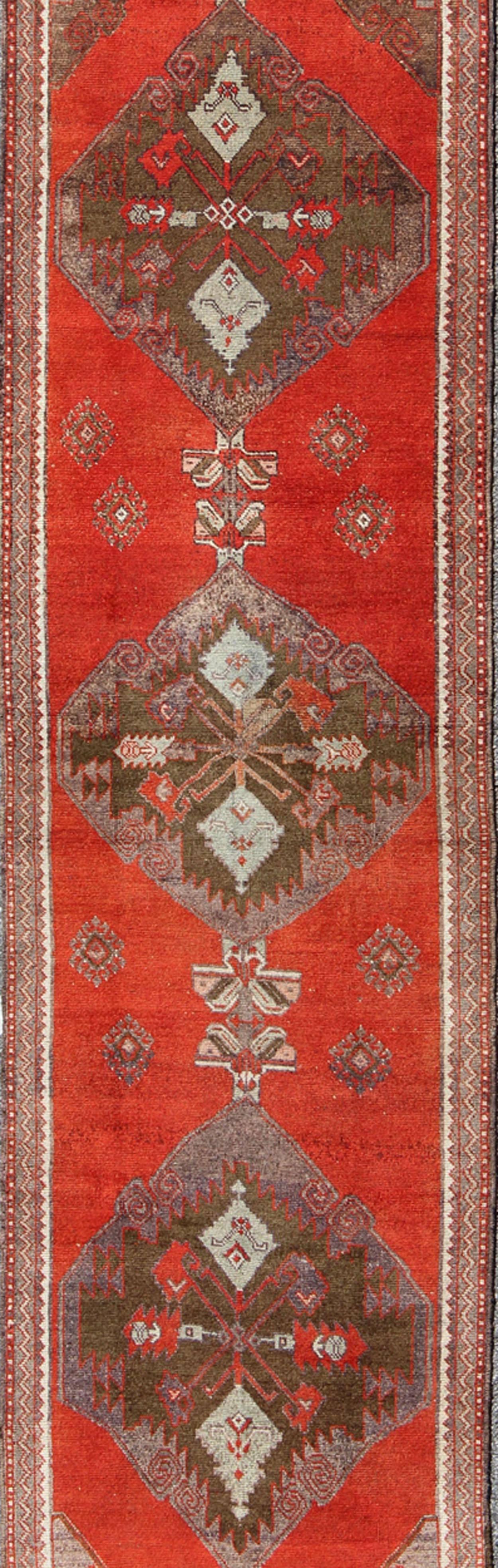 Hand-Knotted Red and Brown Vintage Turkish Oushak Runner with Three Medallion Design For Sale