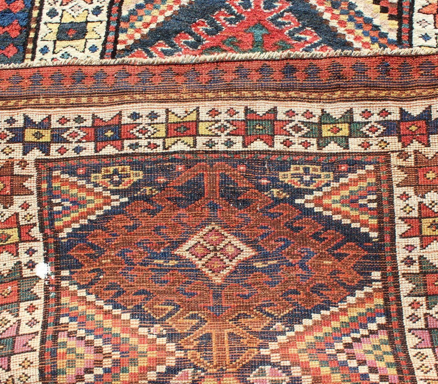 Multicolored Antique Caucasian Kazak Runner with Hooked Latch's and Star Motifs In Excellent Condition In Atlanta, GA
