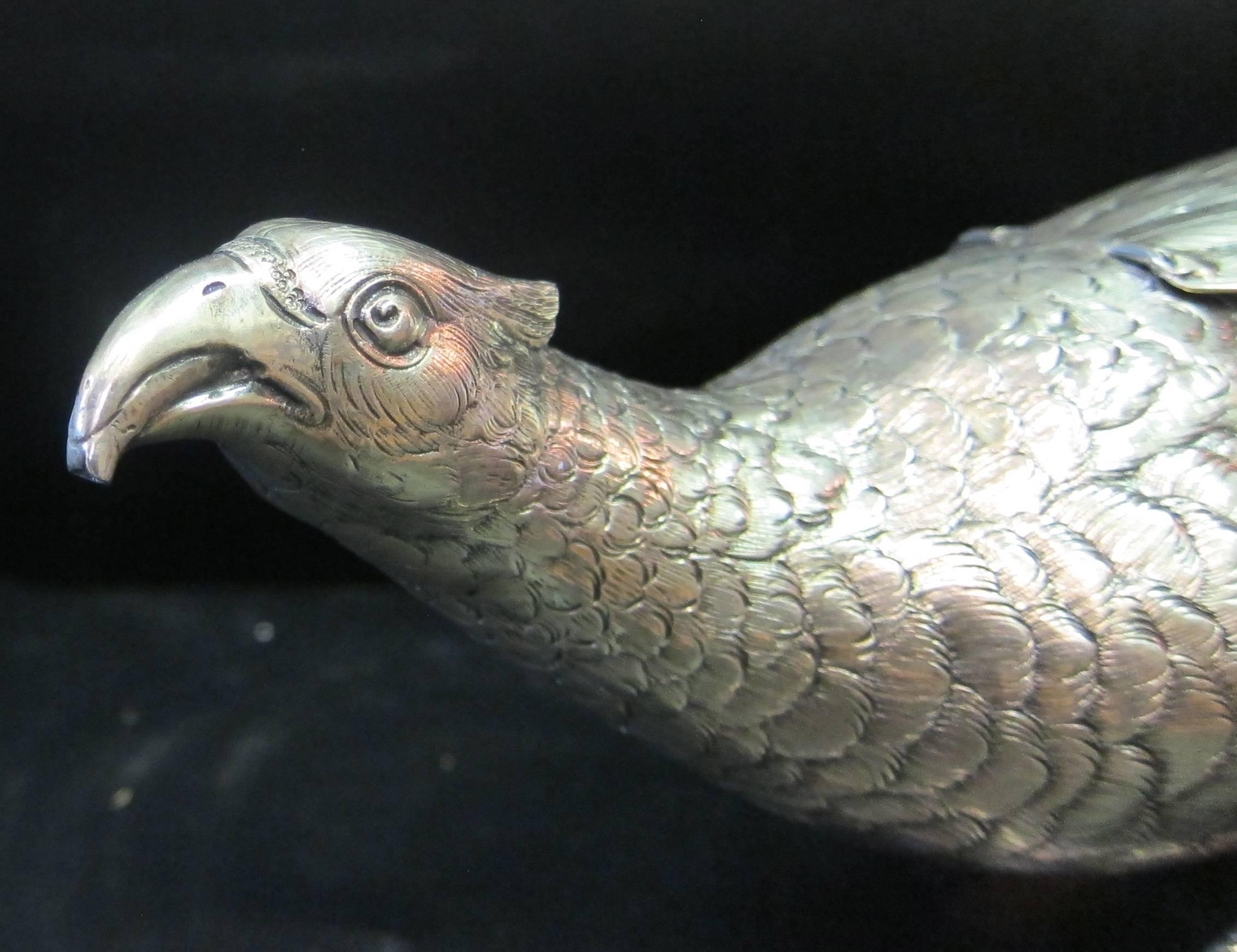 This vintage early 20th century sculpted pheasant figural liquor decanter is rendered in jeweler tested sterling silver & is extraordinary! Hidden beneath the pheasant's wing is the decanter's cap that unscrews for filling & the spout for pouring is