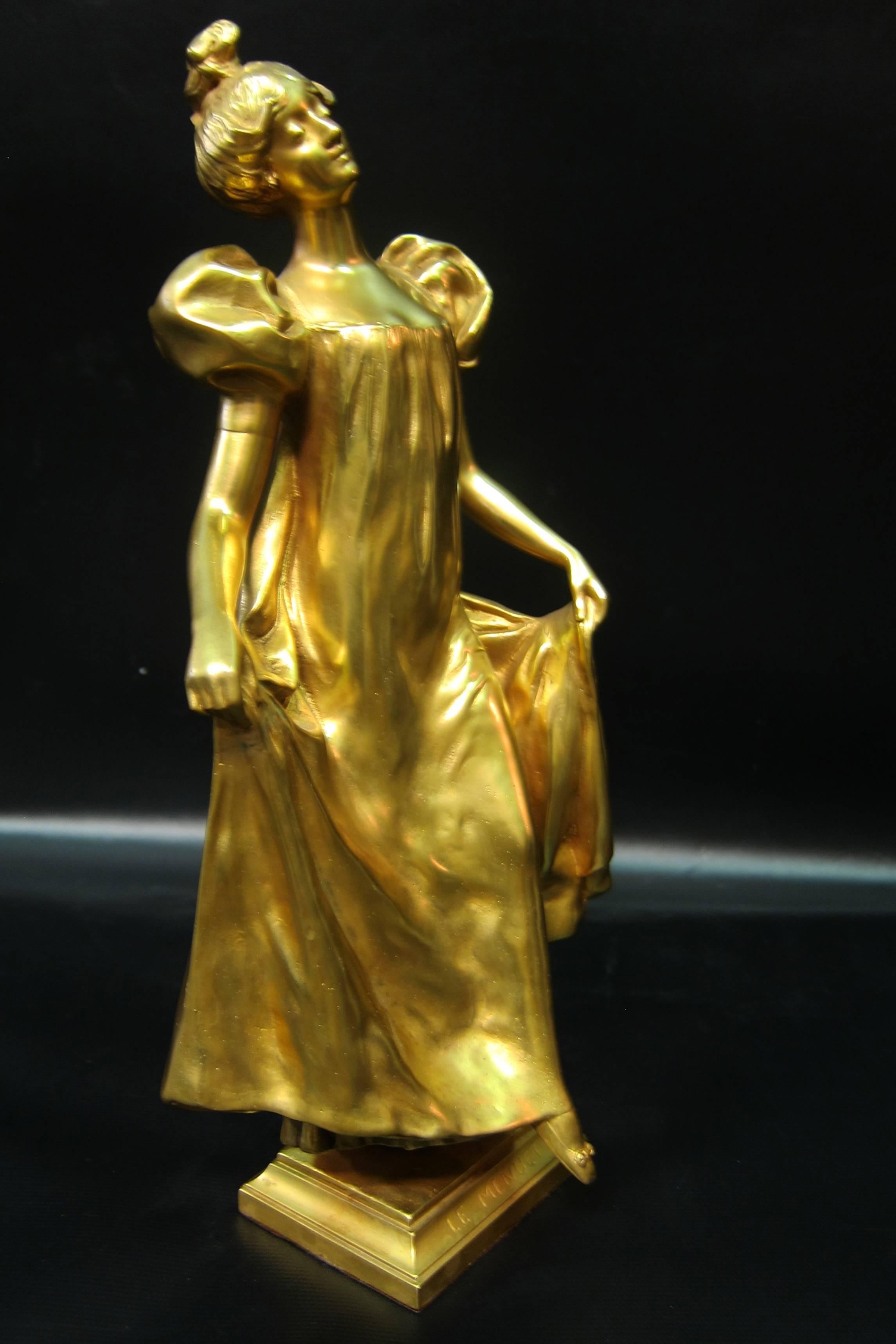 A vintage late early 20th century French sculpture of a young woman, in dore' bronze, dancing the minuet. The sculpture is artist signed, Leo' La porte-Blairsy & impressed with a foundry # 57535-10. The figure is well defined & the artist has