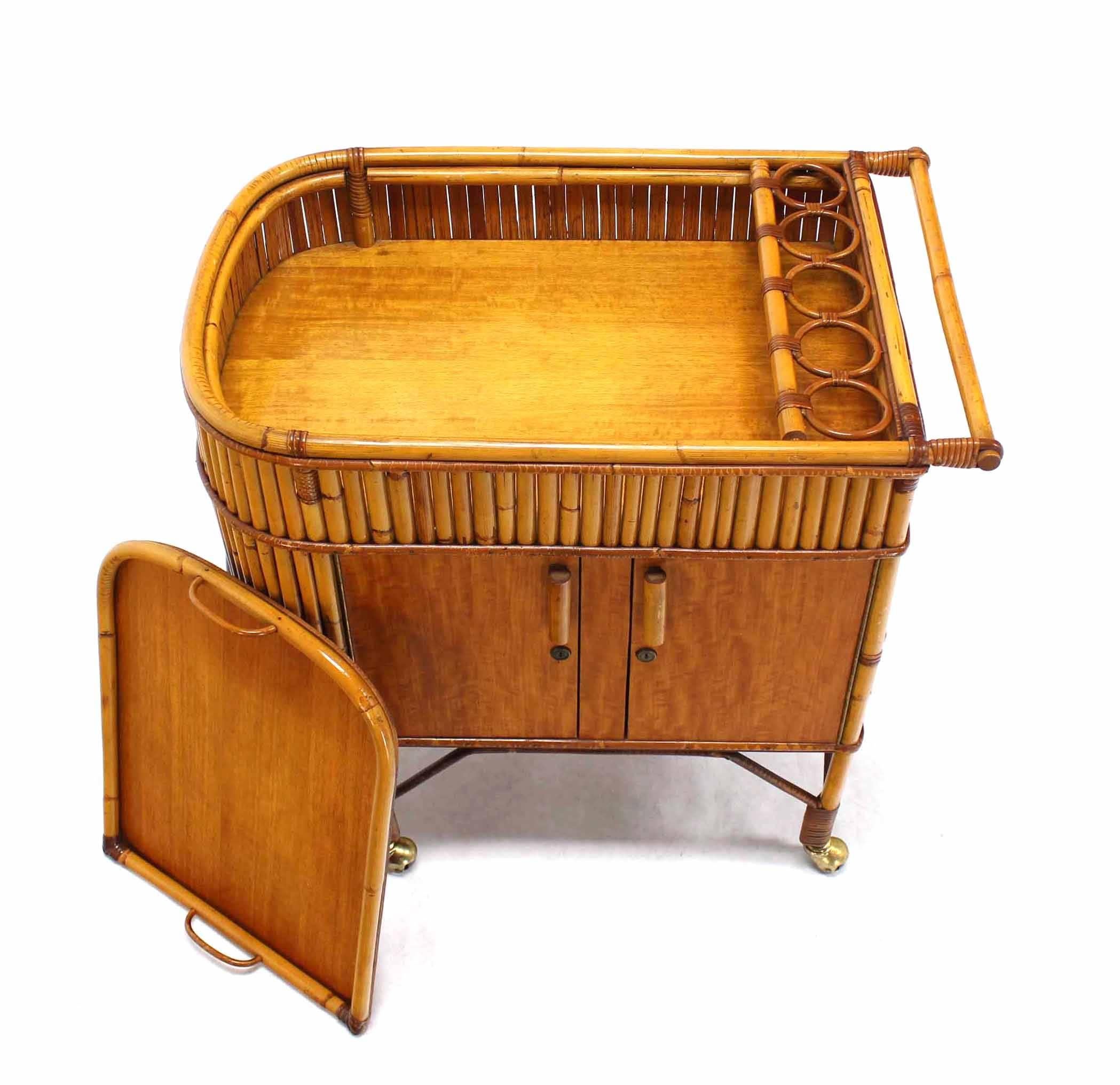 Mid-Century Modern bamboo cart. Very nice craftsmanship and design detail unusual piece. Removable serving tray.
