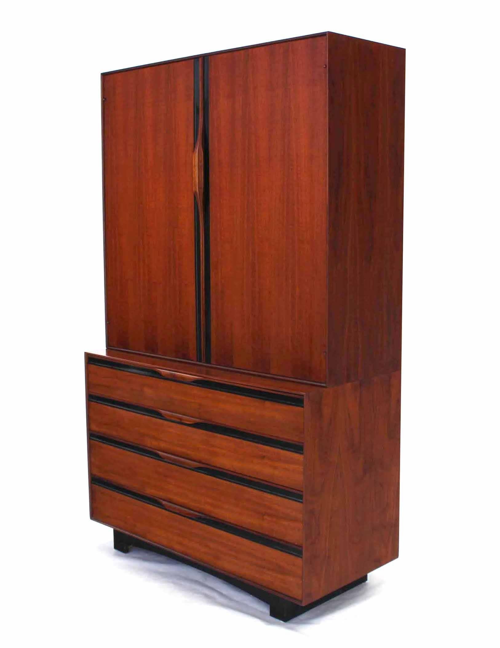 Very nice two part teak chest with hidden mirror and multi drawers compartment. Very beautiful multifunctional cabinet. 
