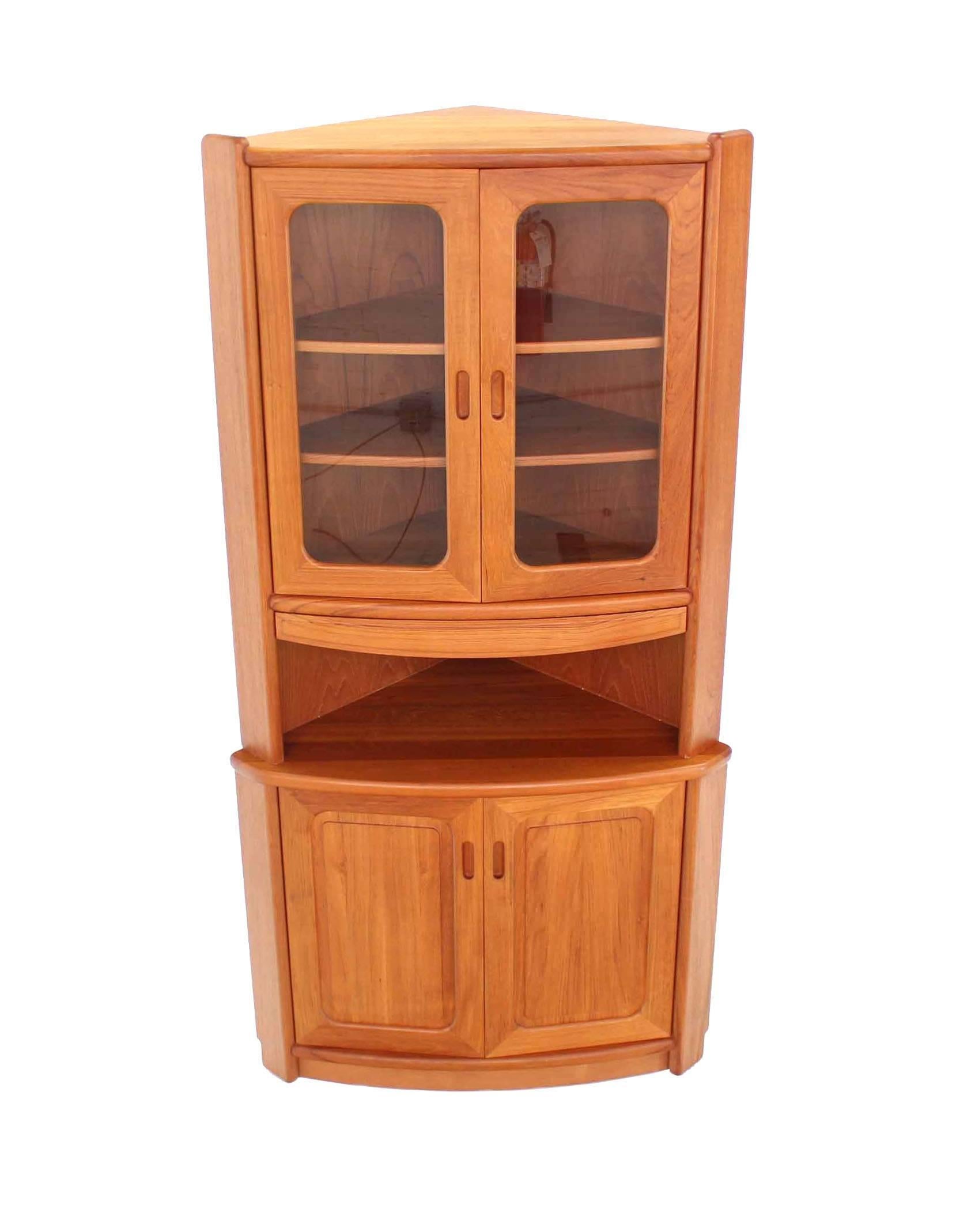 High quality heavy built solid teak Danish modern corner cabinet.