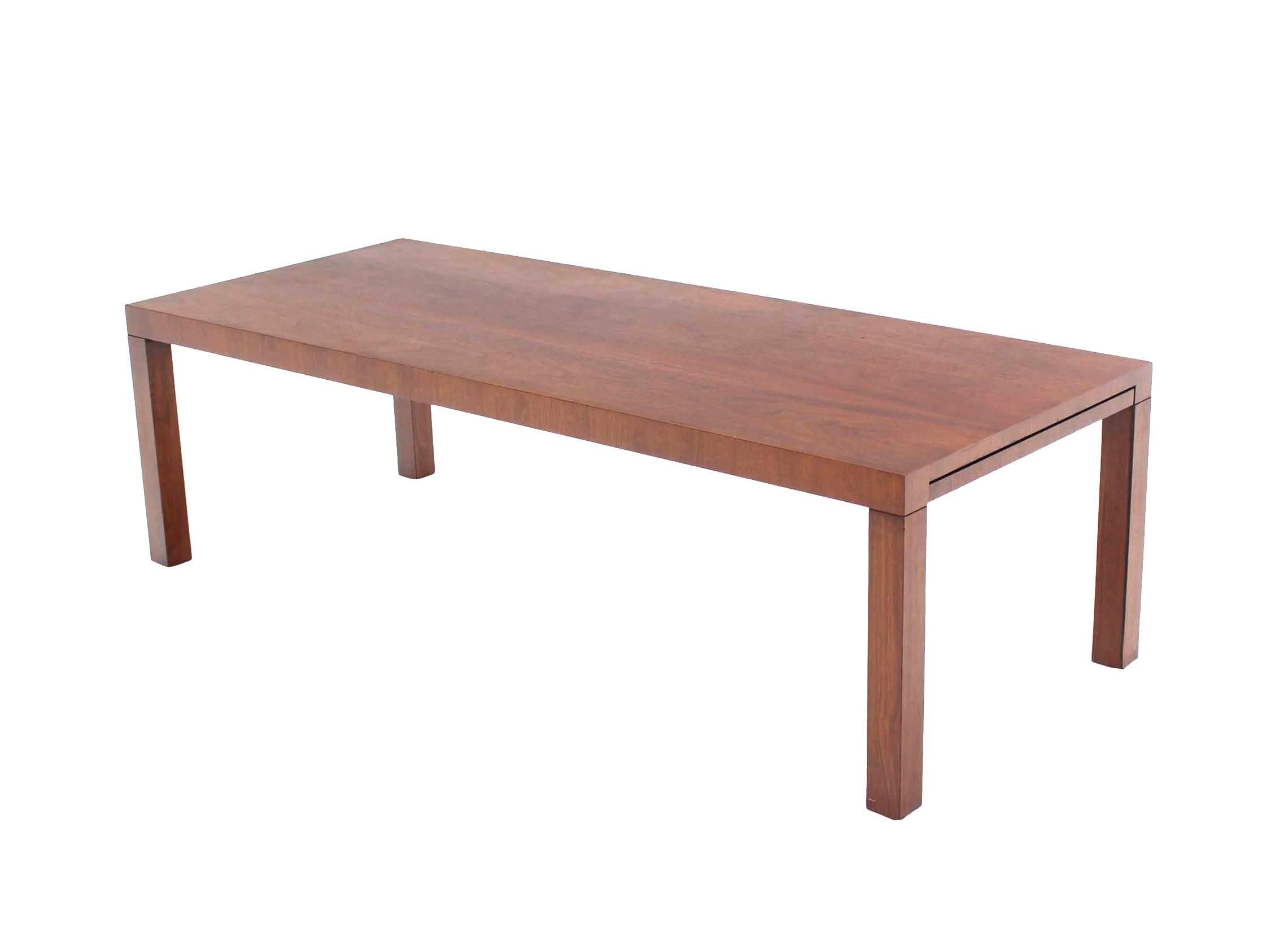 Rectangular Mid-century modern parson walnut coffee table on 4 square legs.