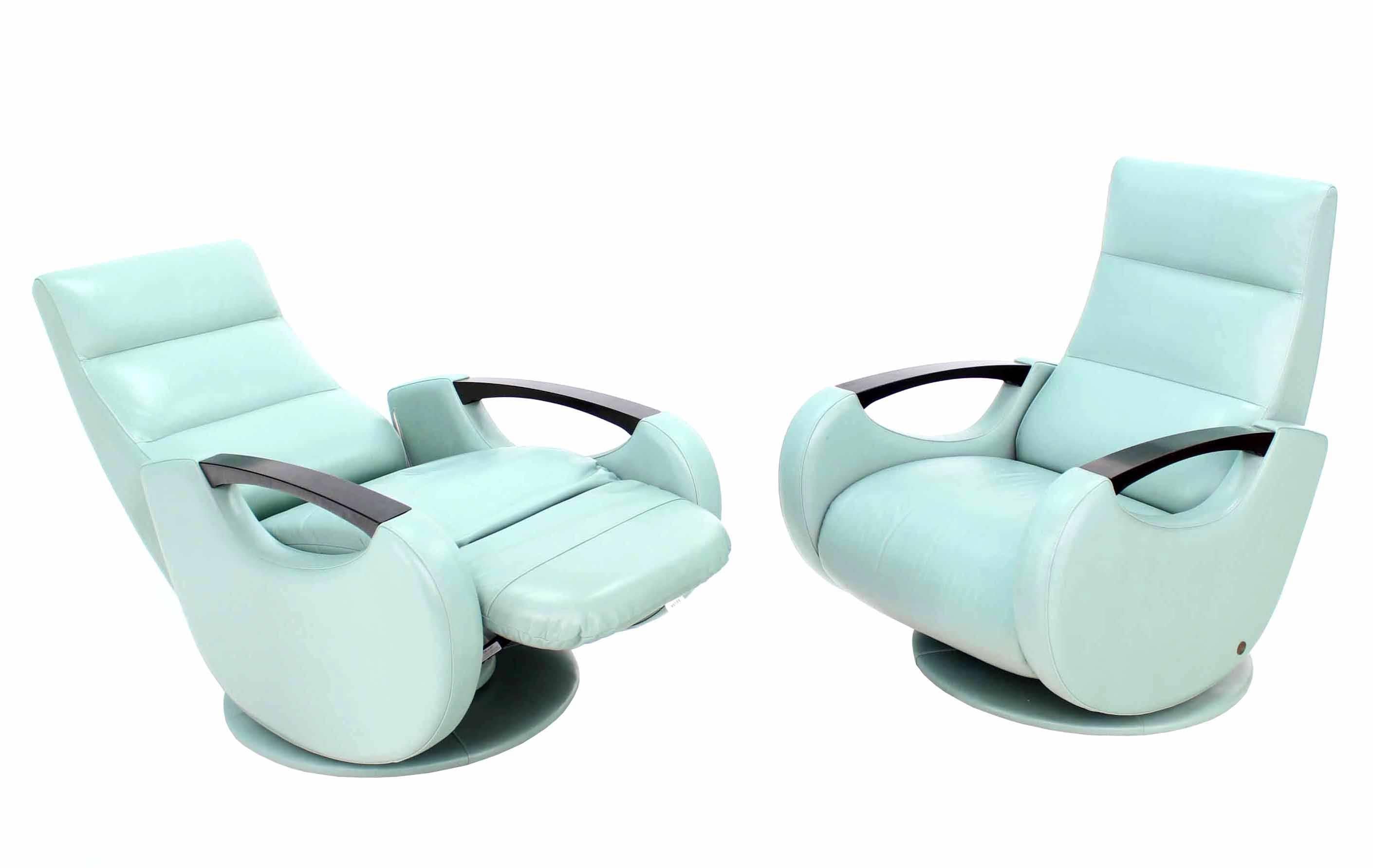 Pair of space age Mid Century modern swivel lounge chairs recliners. This is a very unusual looking and very comfortable pair of chairs.