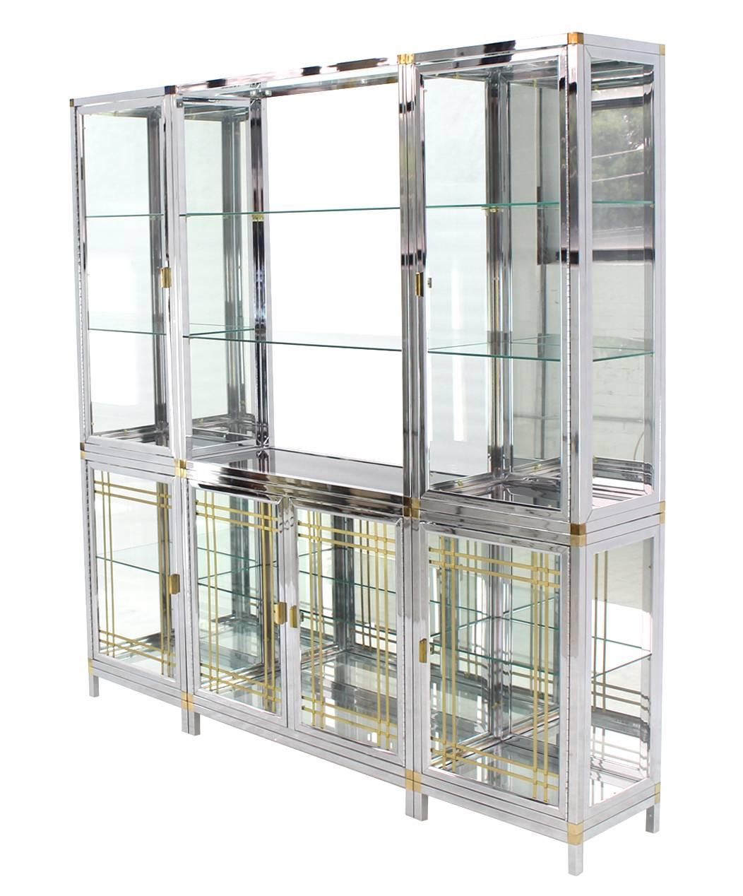 Very nice quality vitrine showcase or etagere. The whole piece consists of nine pieces: Three base frames, three bottom cabinets and three larger top compartments.