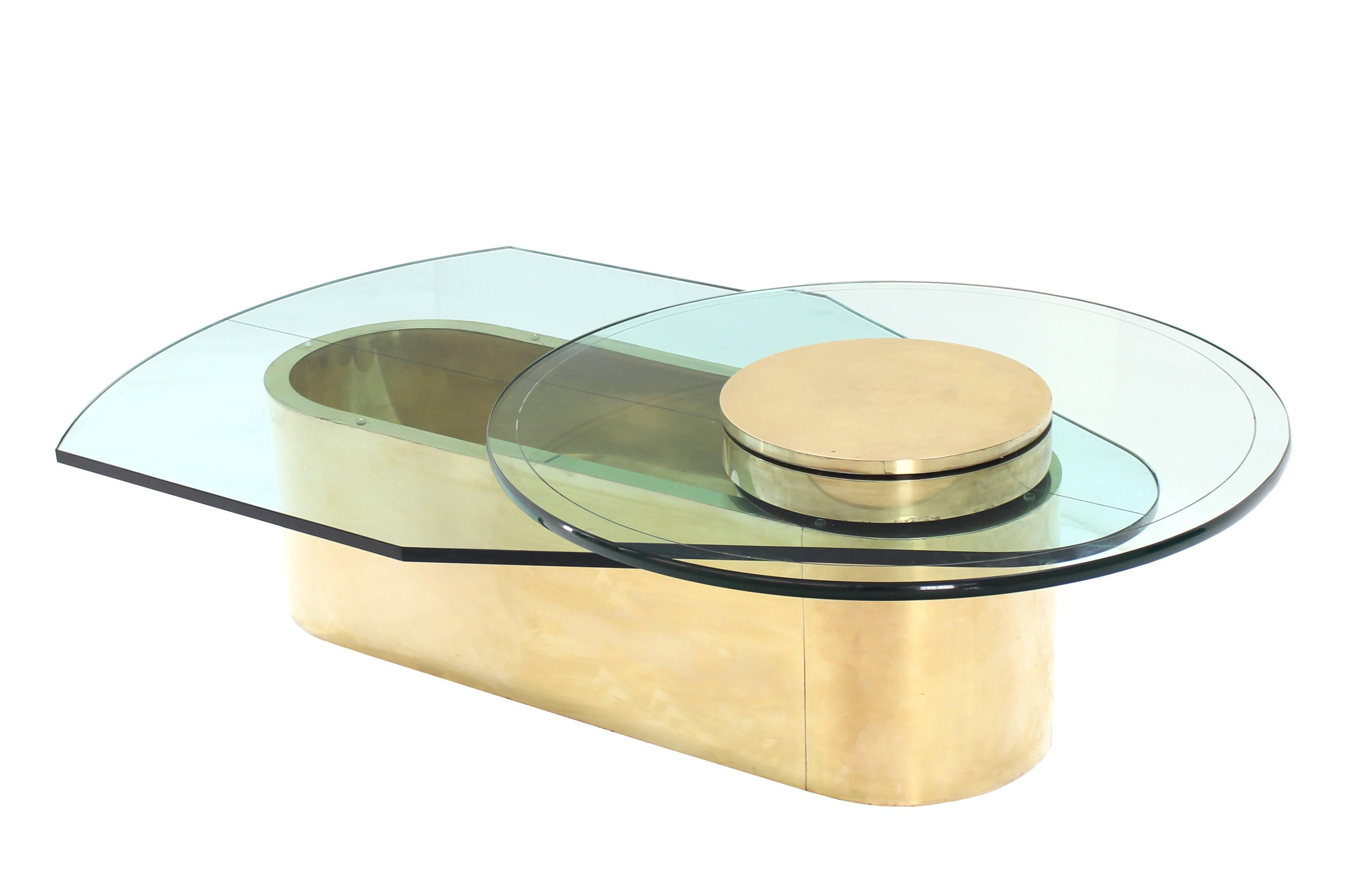 Very unusual Mid-Century Modern studio work brass oval base glass top coffee table. Measures: 3/4.
