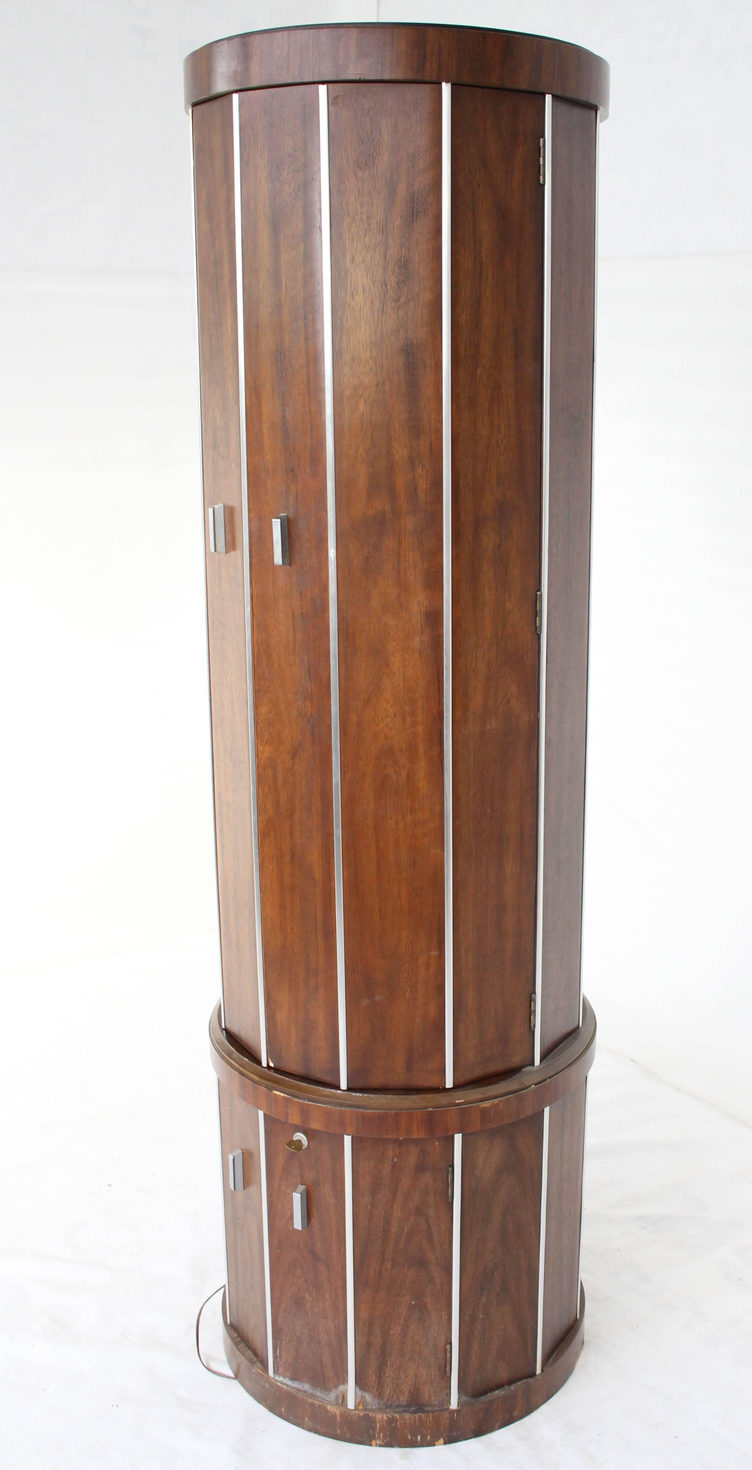 Mid-Century Modern cylinder drum shape walnut liquor cabinet. Rare cabinet in as is (minor damage as pictured) condition.
  