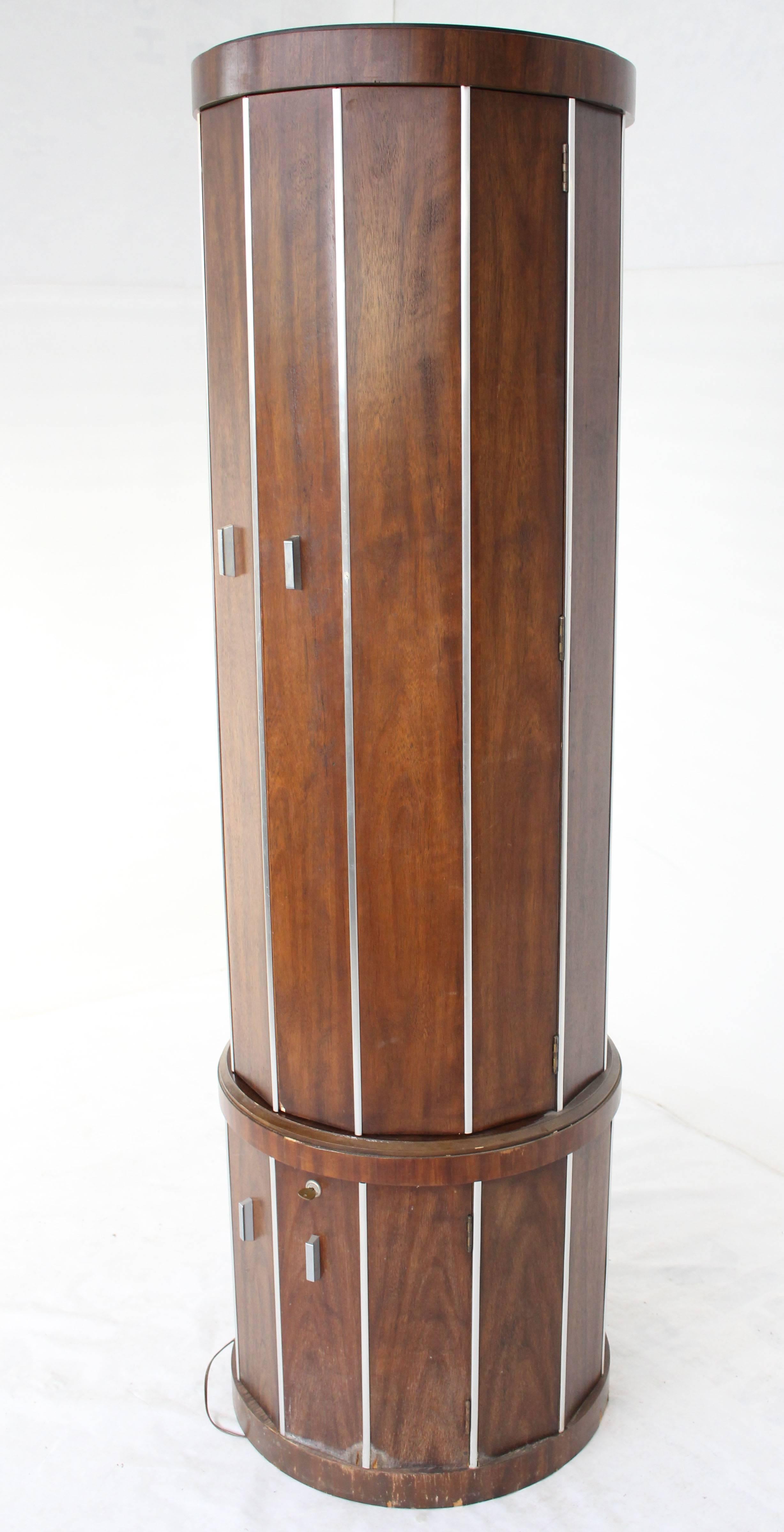 Mid-Century Modern cylinder drum shape walnut liquor cabinet. Rare cabinet in as is (minor damage as pictured) condition.
  