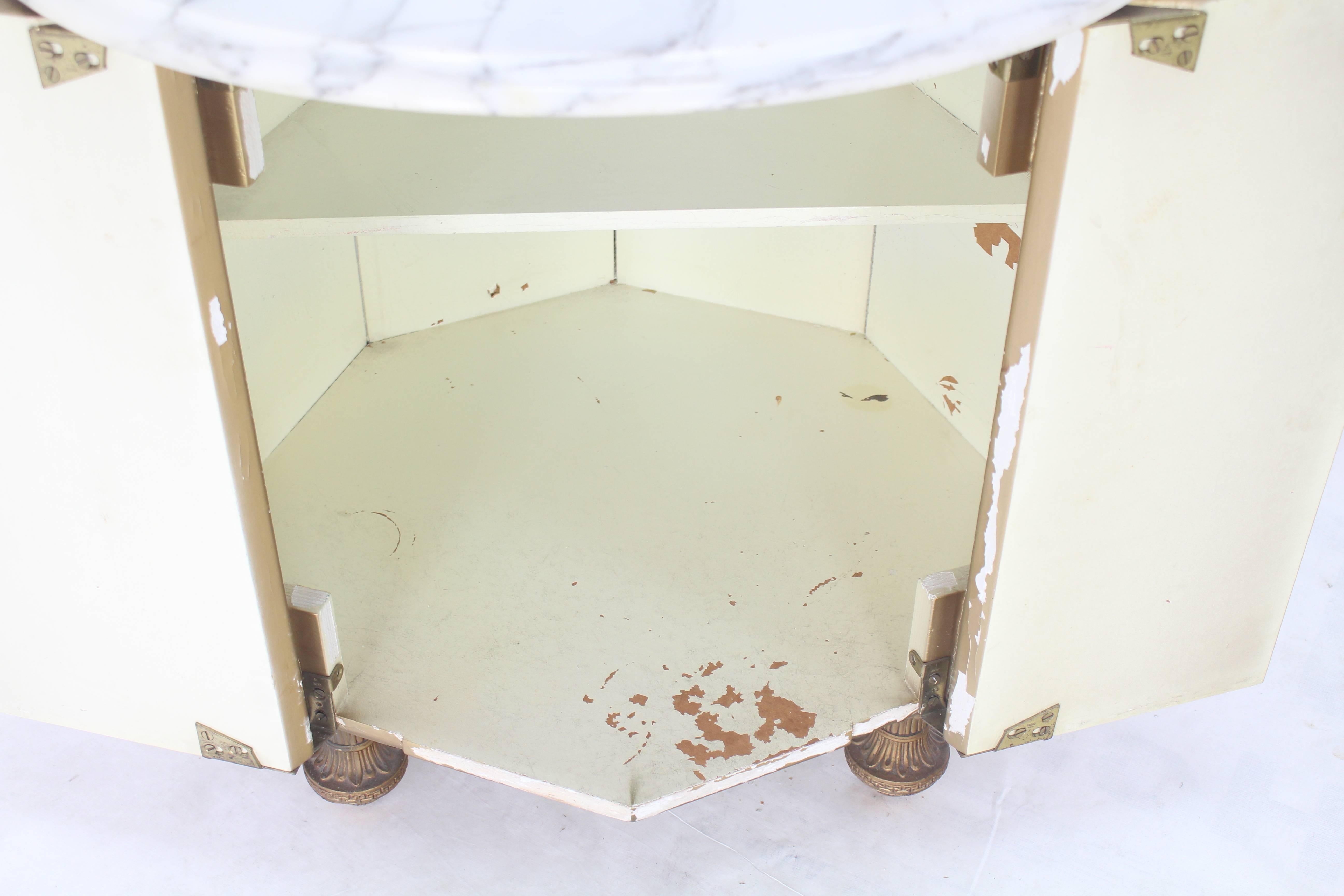 Drum shape reversed gold leaf mirror panels (forming octagon) cabinet nightstand with marble top.