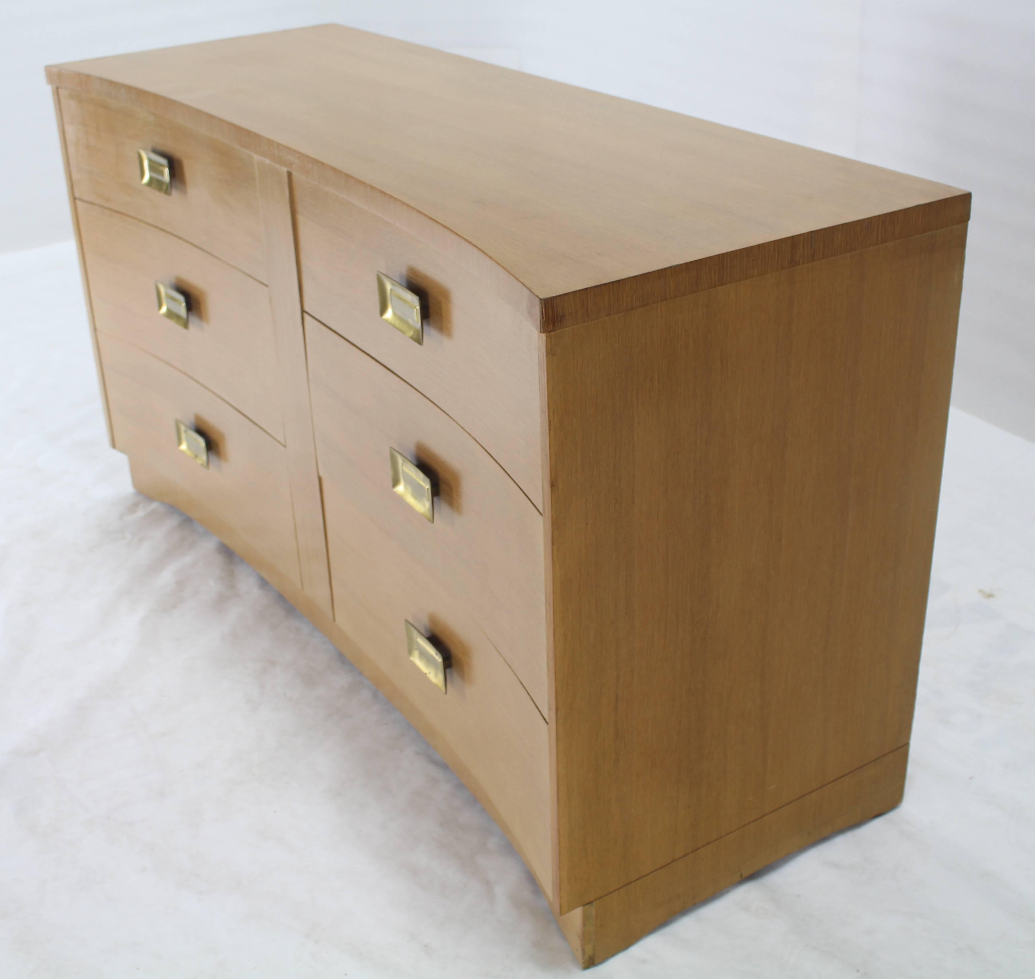 Mid-Century Modern long coerced oak dresser with brass pulls.