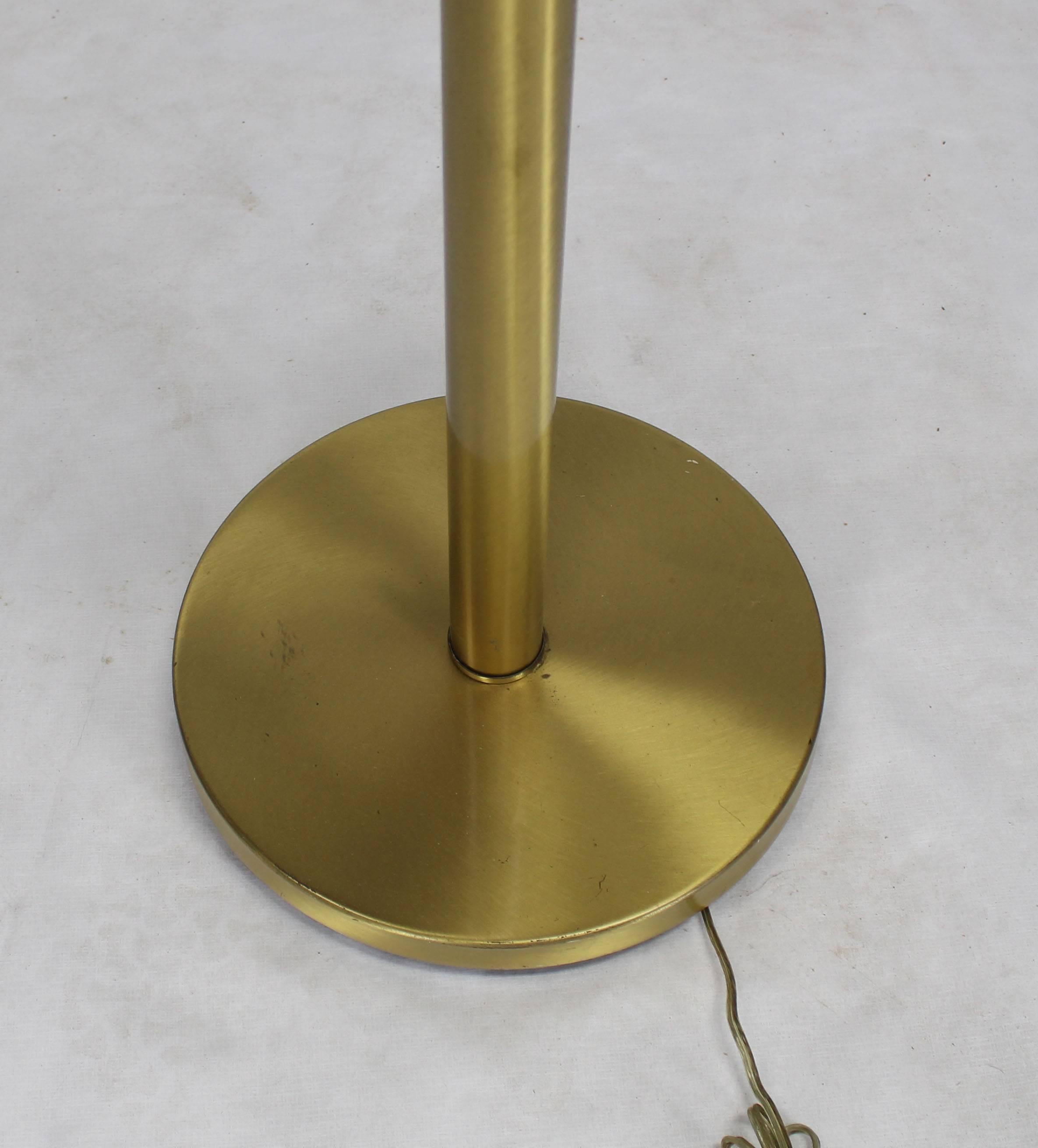 Mid-Century Modern brass floor lamp with iridescent shade.
 