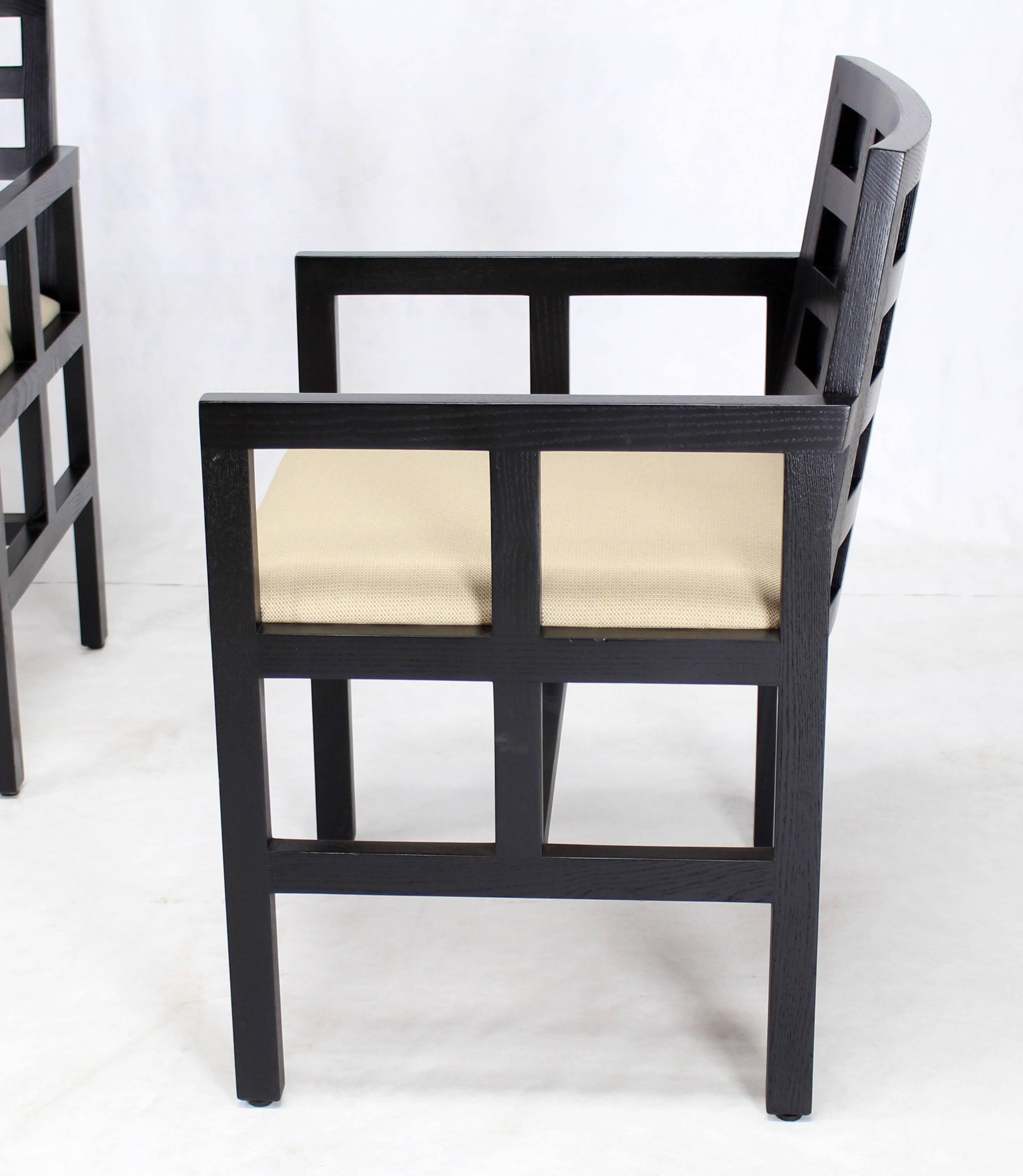 Set of four Mid-Century Modern frame sides design side chairs. Very solid construction and sharp look. Ebonised finish with solid wood upholstery.