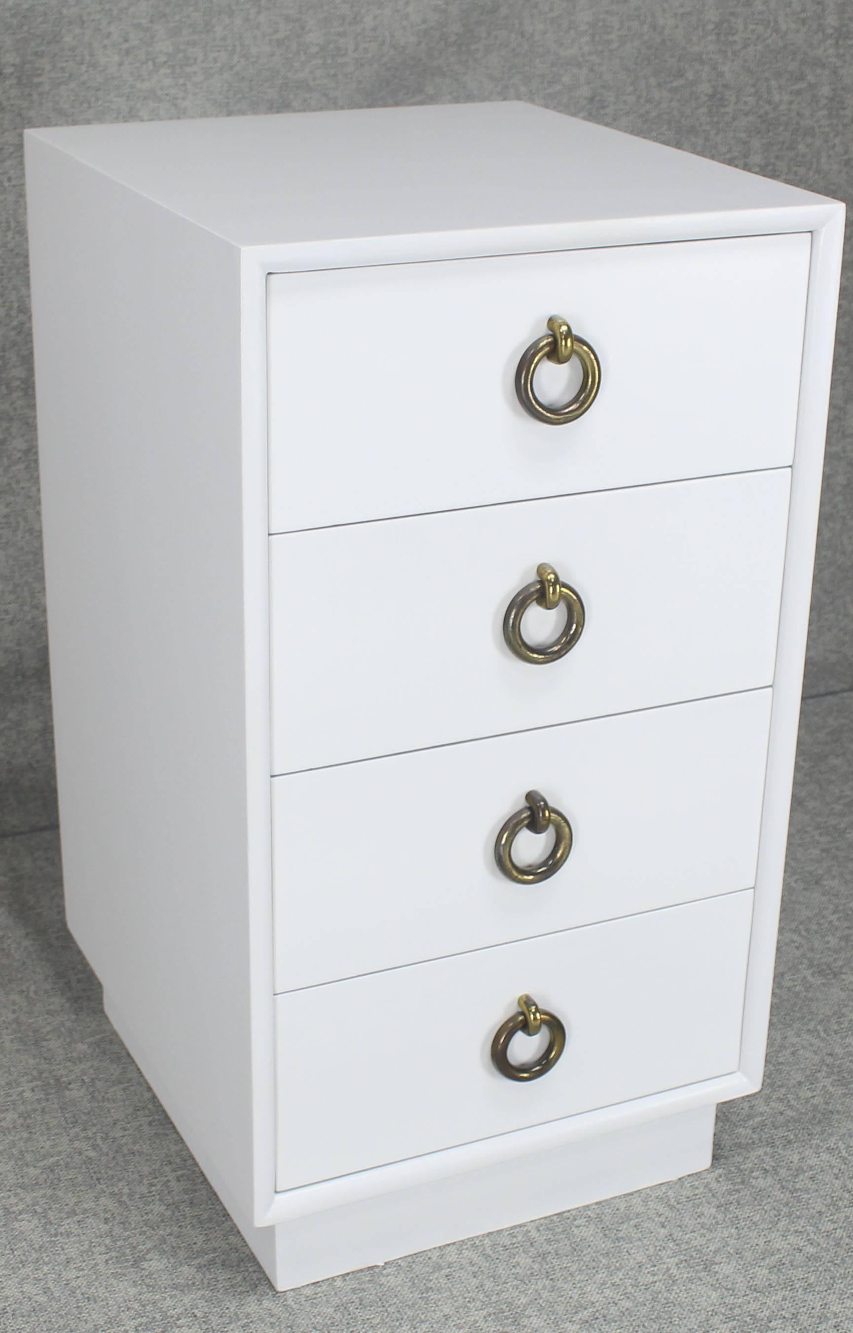 White lacquer solid ring pulls four drawers Mid-Century Modern cabinet end table stand or chest of drawers. Nice medium gloss white lacquer finish.