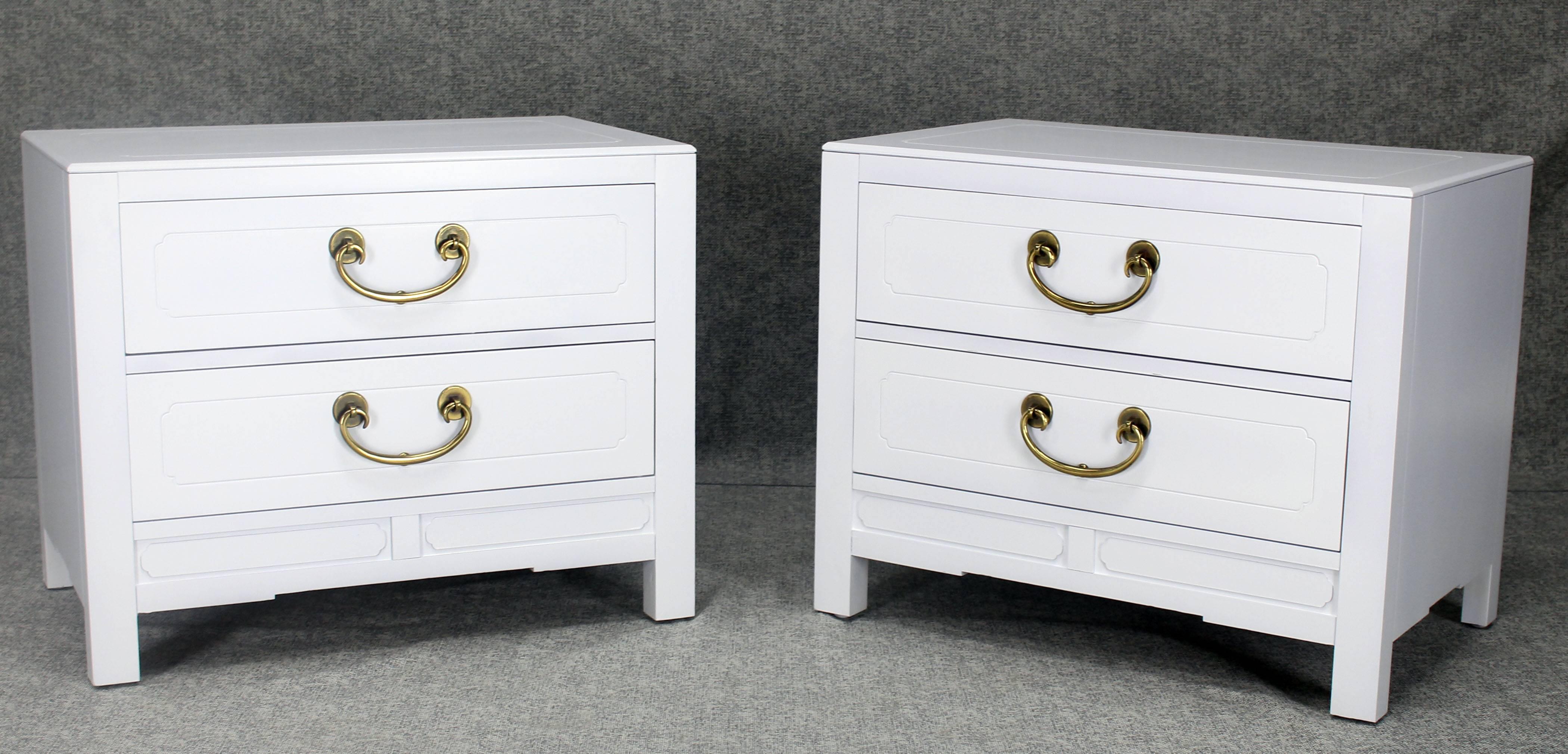 Pair of very nice white lacquer two-drawer stands, cabinets or nightstands with brass pulls. Medium gloss finish.
 