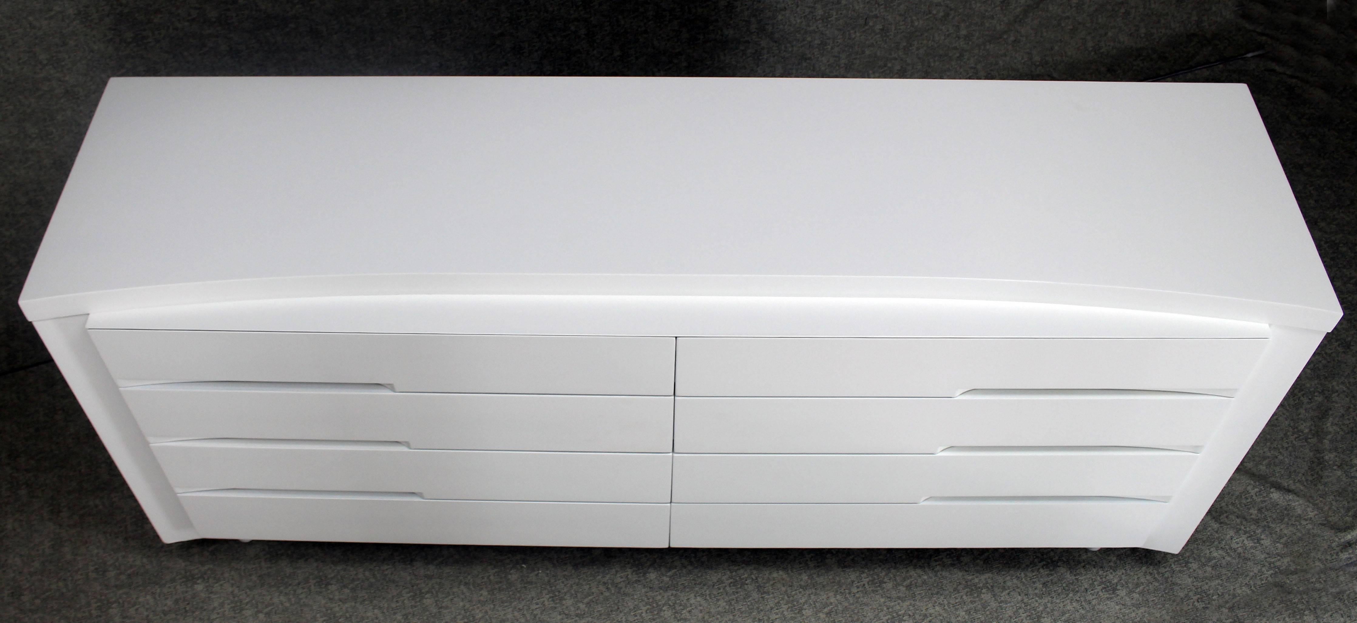 Mid-Century Modern white lacquer long dresser credenza. Beautiful medium gloss finish.