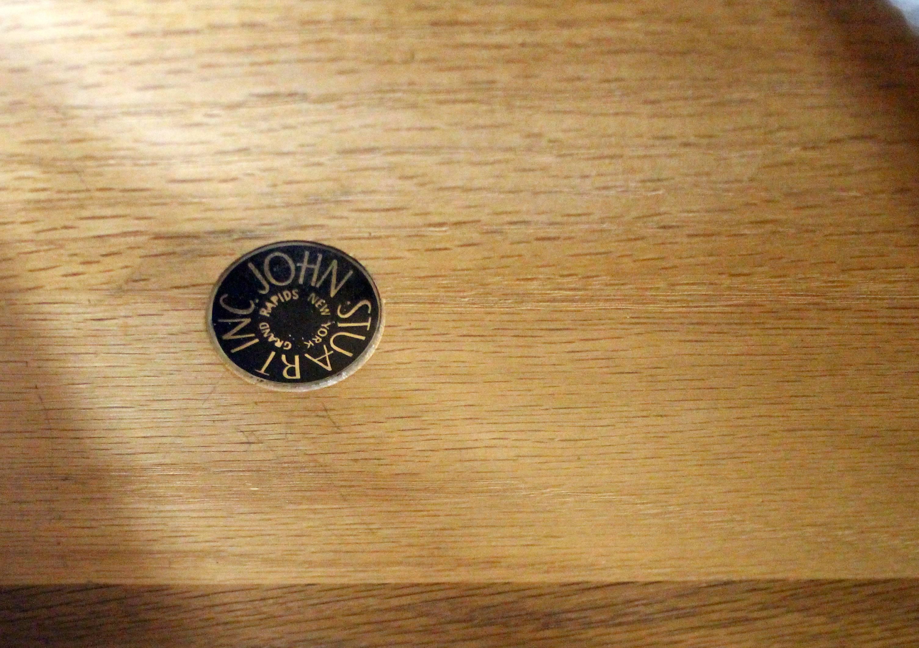 Black lacquer Mid-Century Modern desk by John Stuart.
Nice polished brass pulls, medium gloss lacquer finish.
    