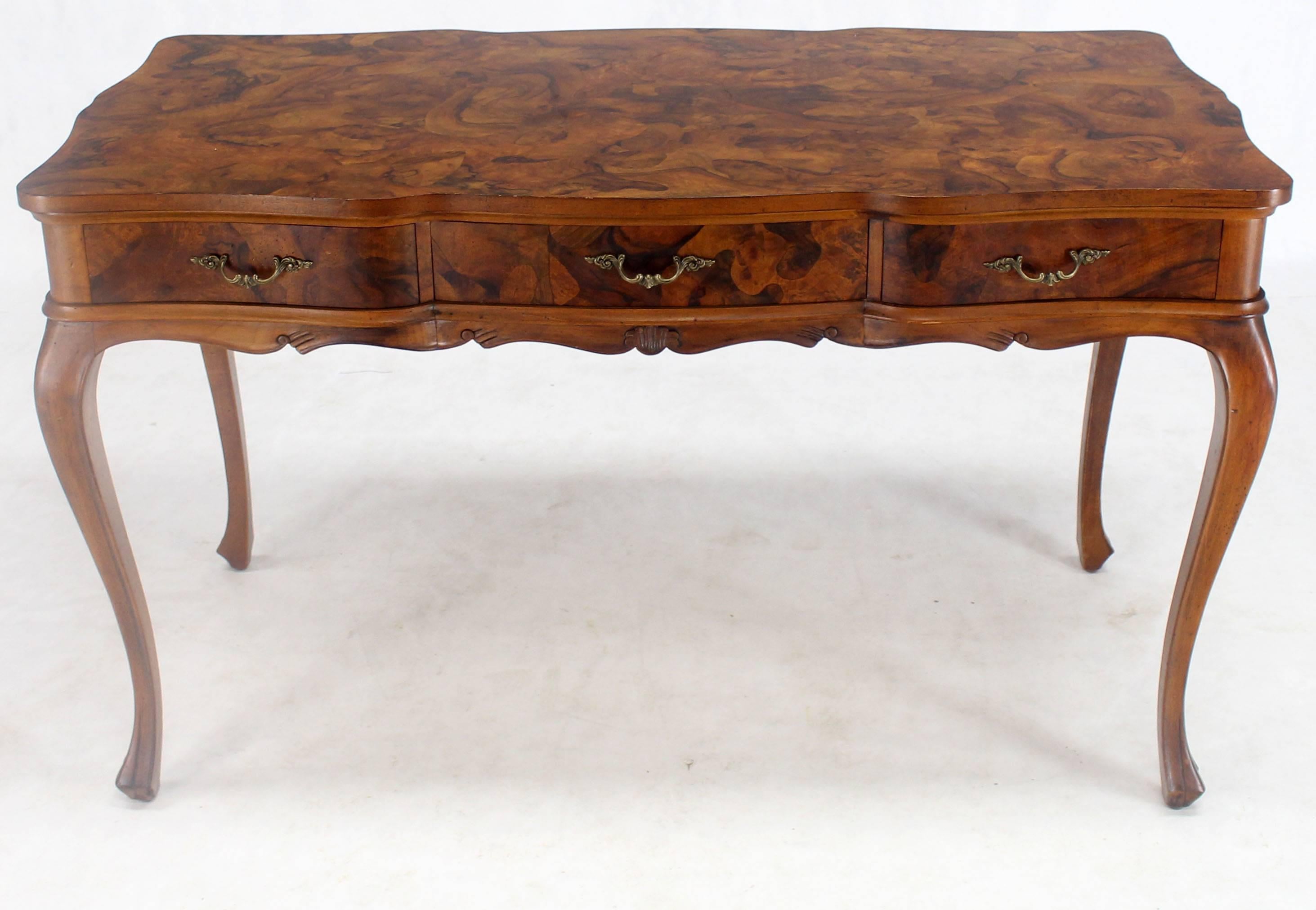 Decorative Mid-Century Modern patch burl work writing table or desk or a large console. Three drawers.