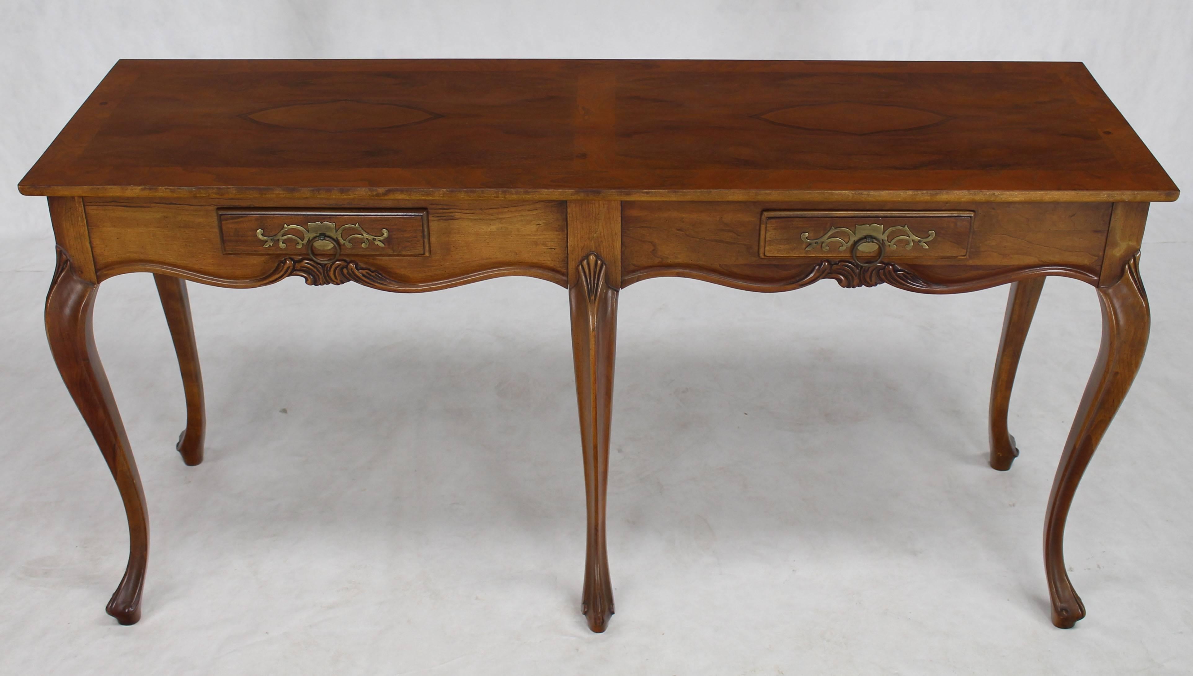 Baker walnut console table with two drawers.