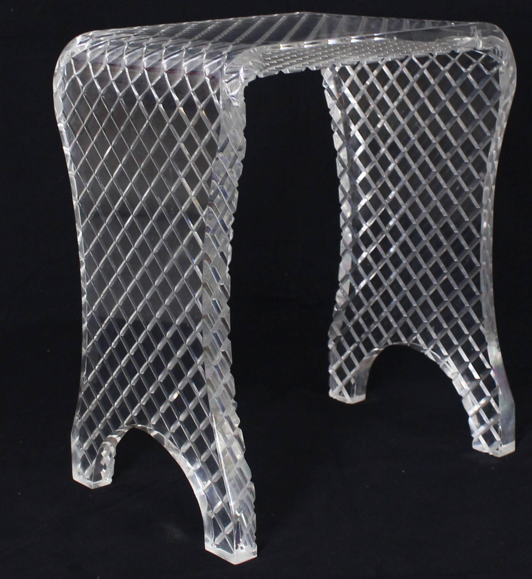 Mid-Century Modern diamond cut Lucite bench or stool.
         