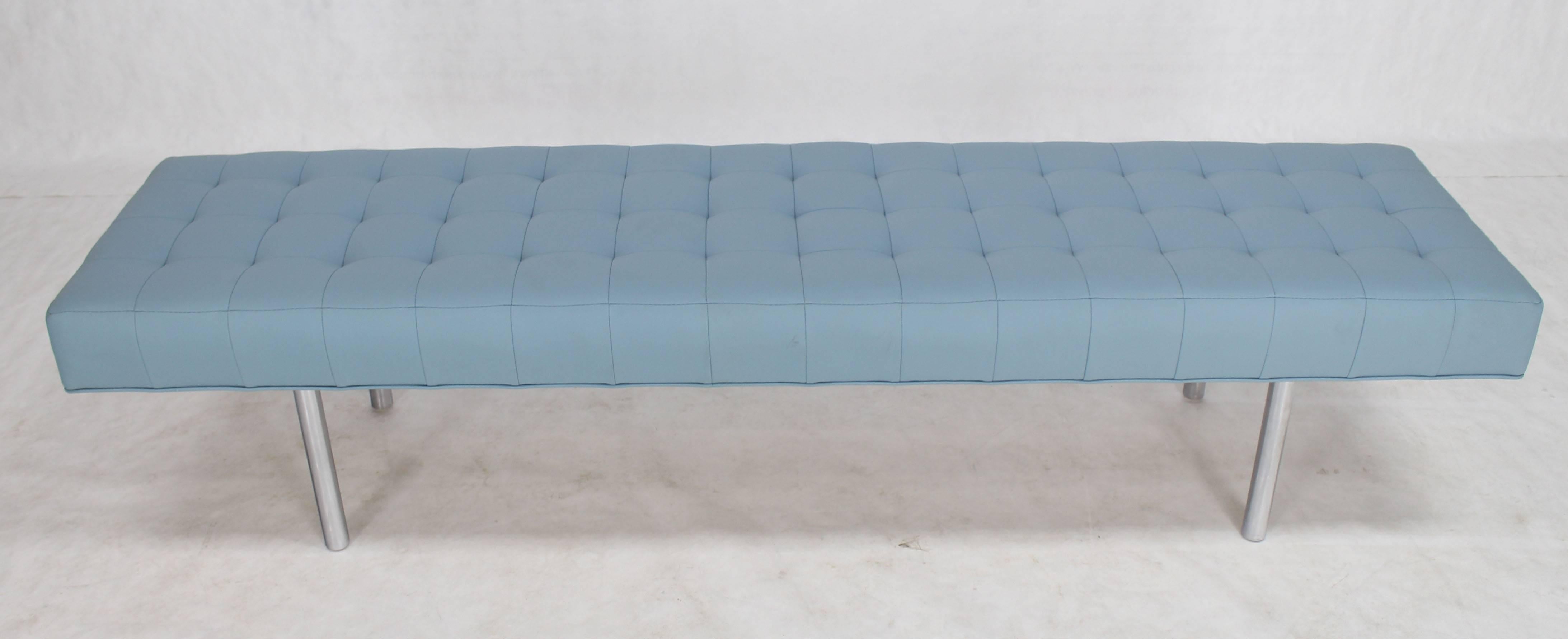 Light blue tufted modern upholstery bench.