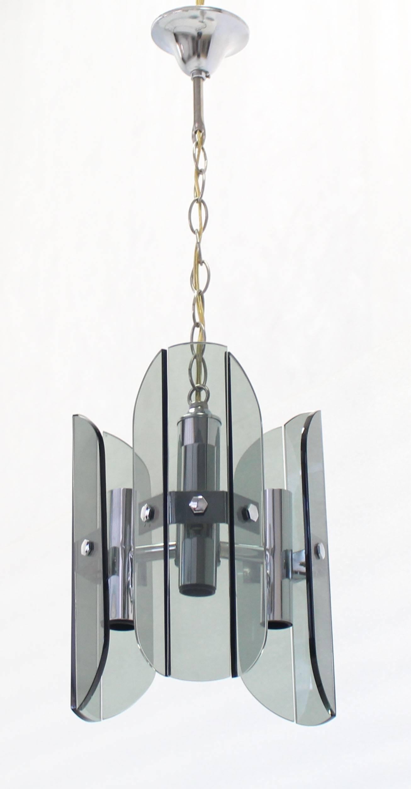Midcentury Italian modern smoked glass football shape pendant chandelier light fixture. The actual pendant height is 12