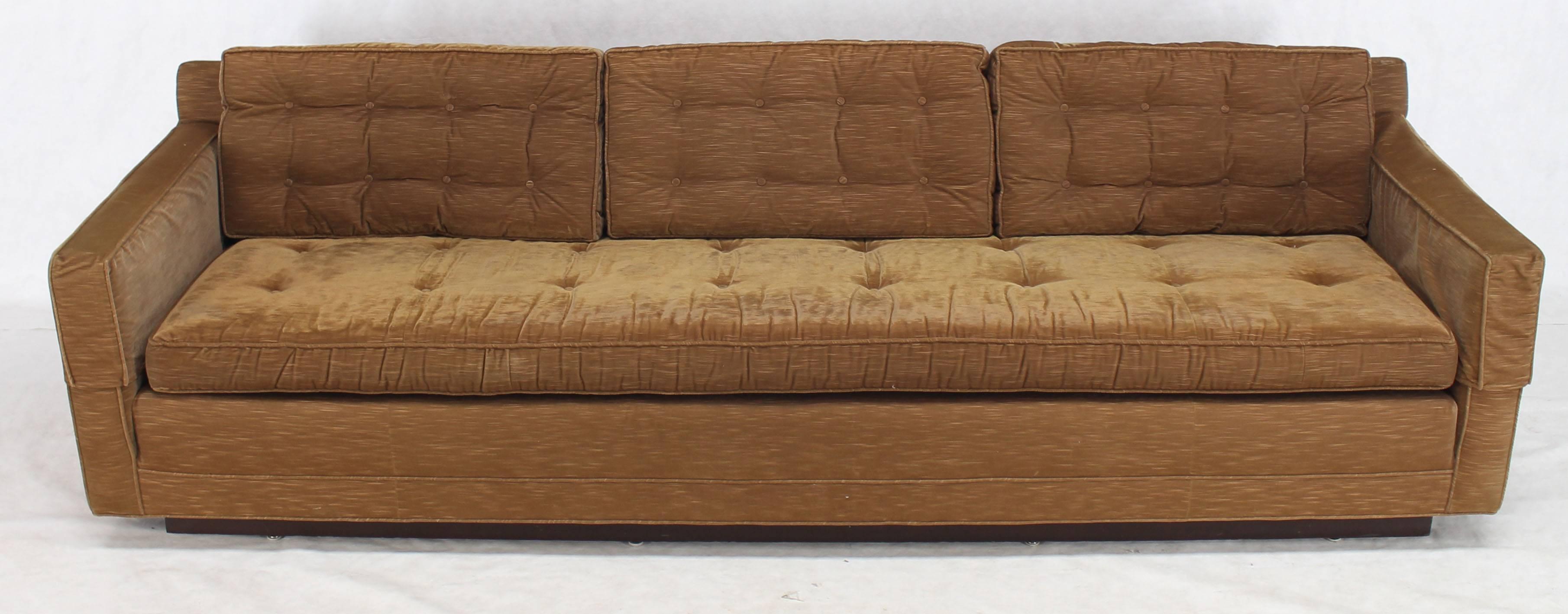 Long angular design Mid-Century Modern design base light coffee color sofa.