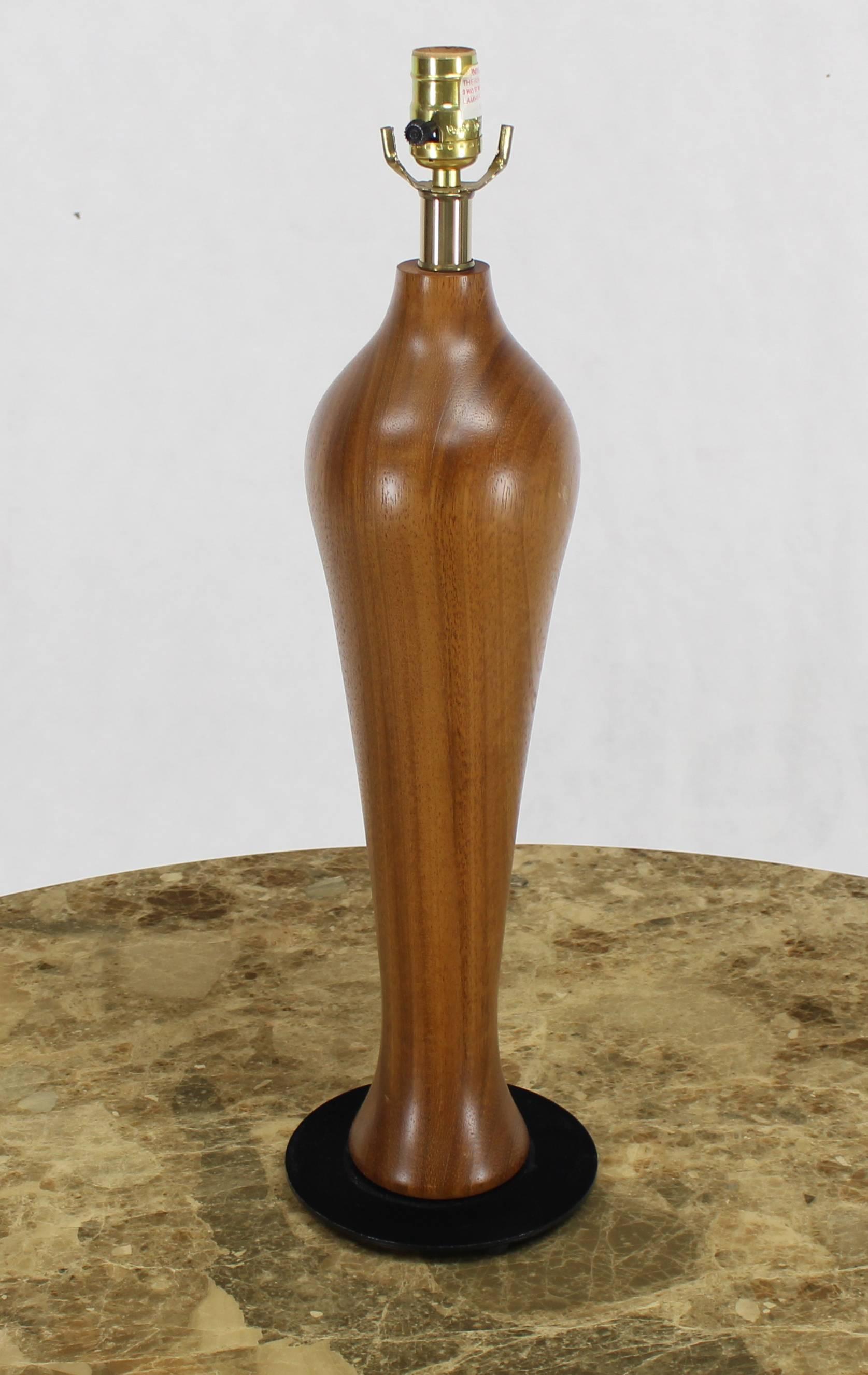 Midcentury Danish modern turned teak or walnut table lamp.
 