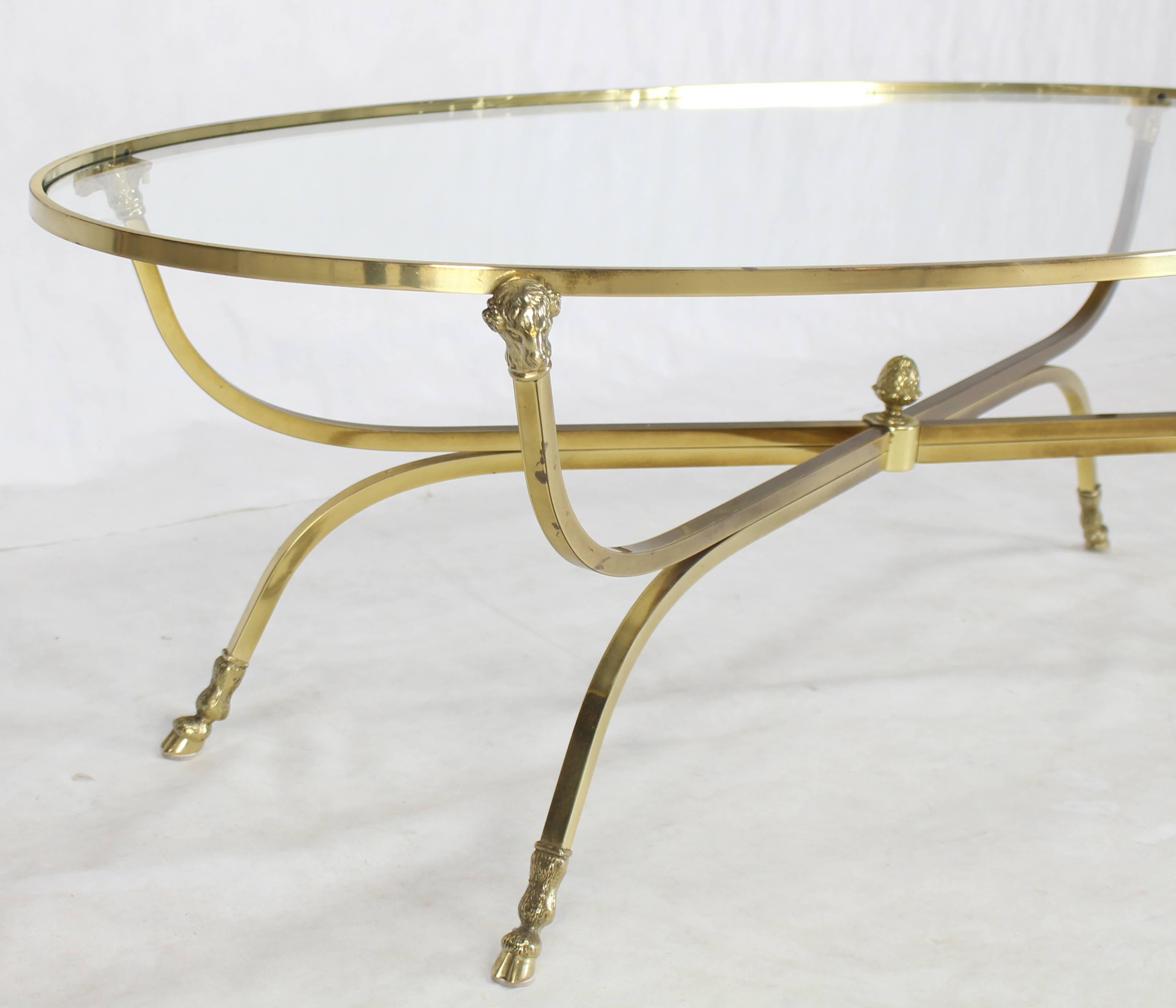 gold and glass oval coffee table