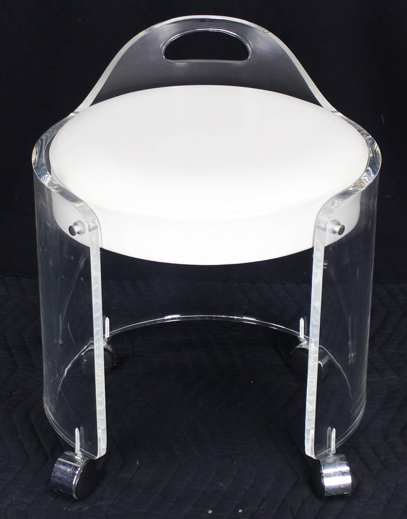Mid-Century Modern round upholstered bent Lucite stool on wheels. Thick Lucite solid and steady design.