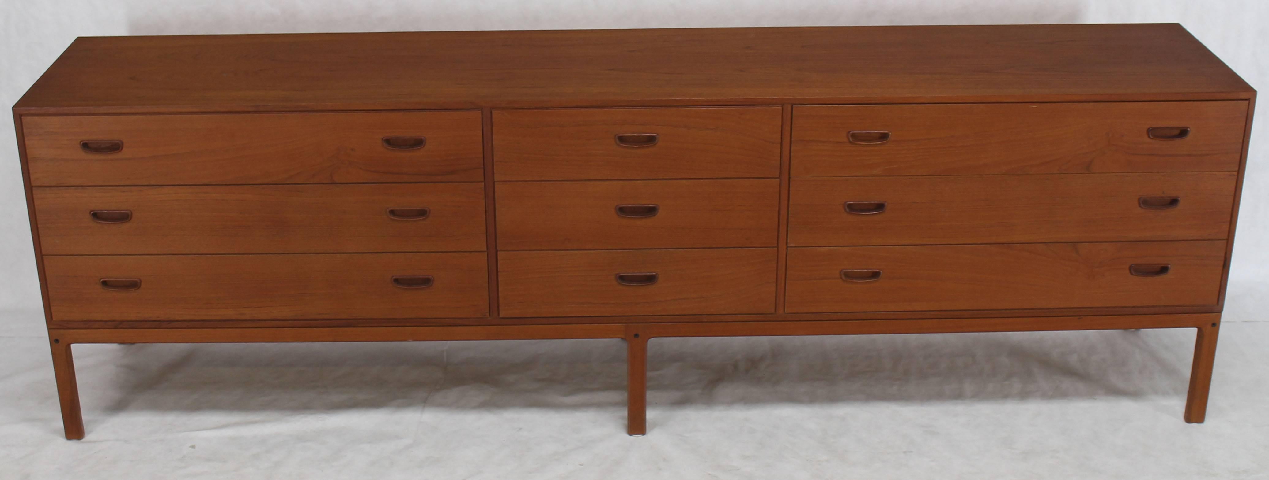 Slick design extra long Mid-Century Modern teak nine-drawer dresser.