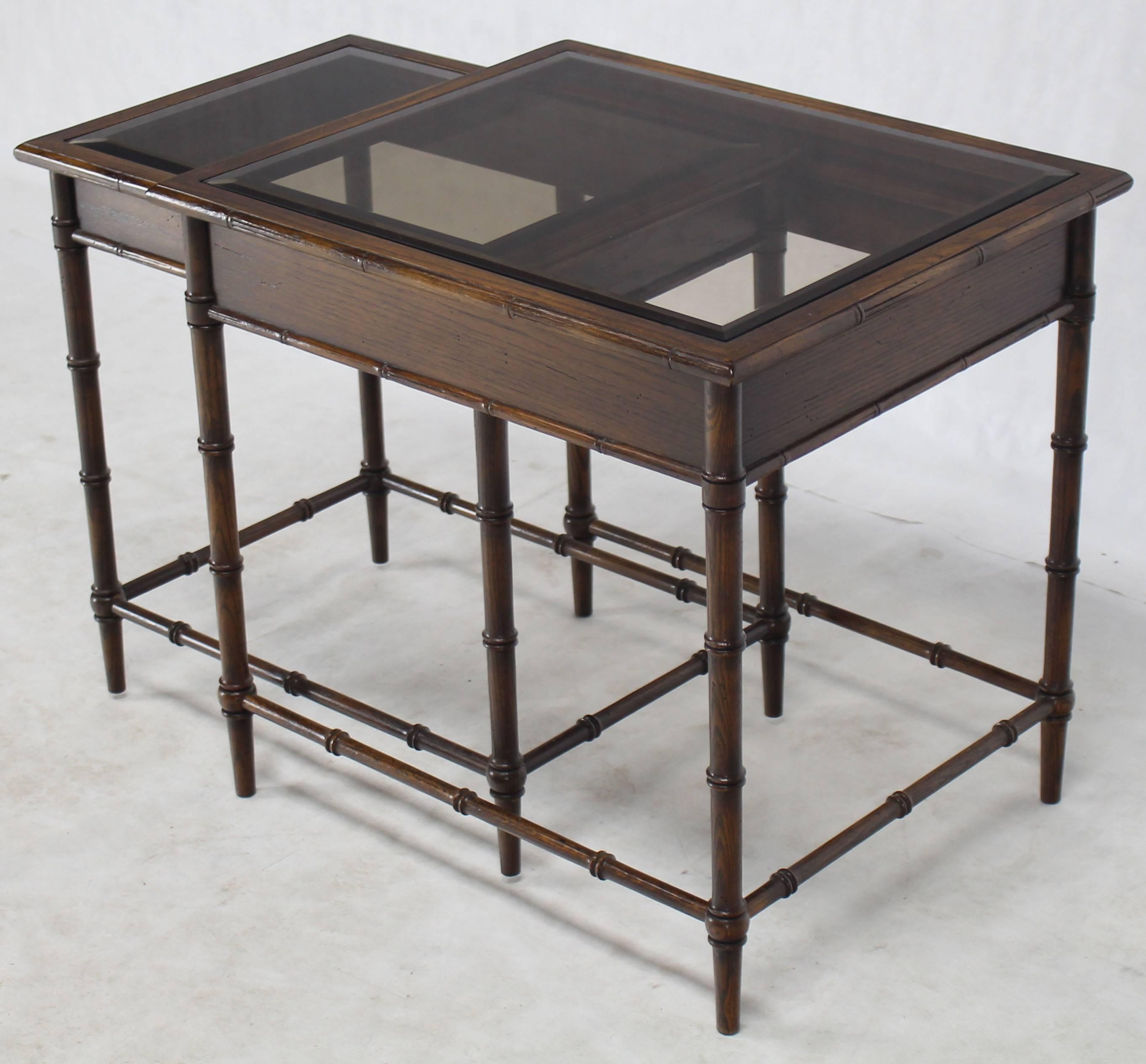 Mid-Century Modern smoked glass tops nesting side tables.