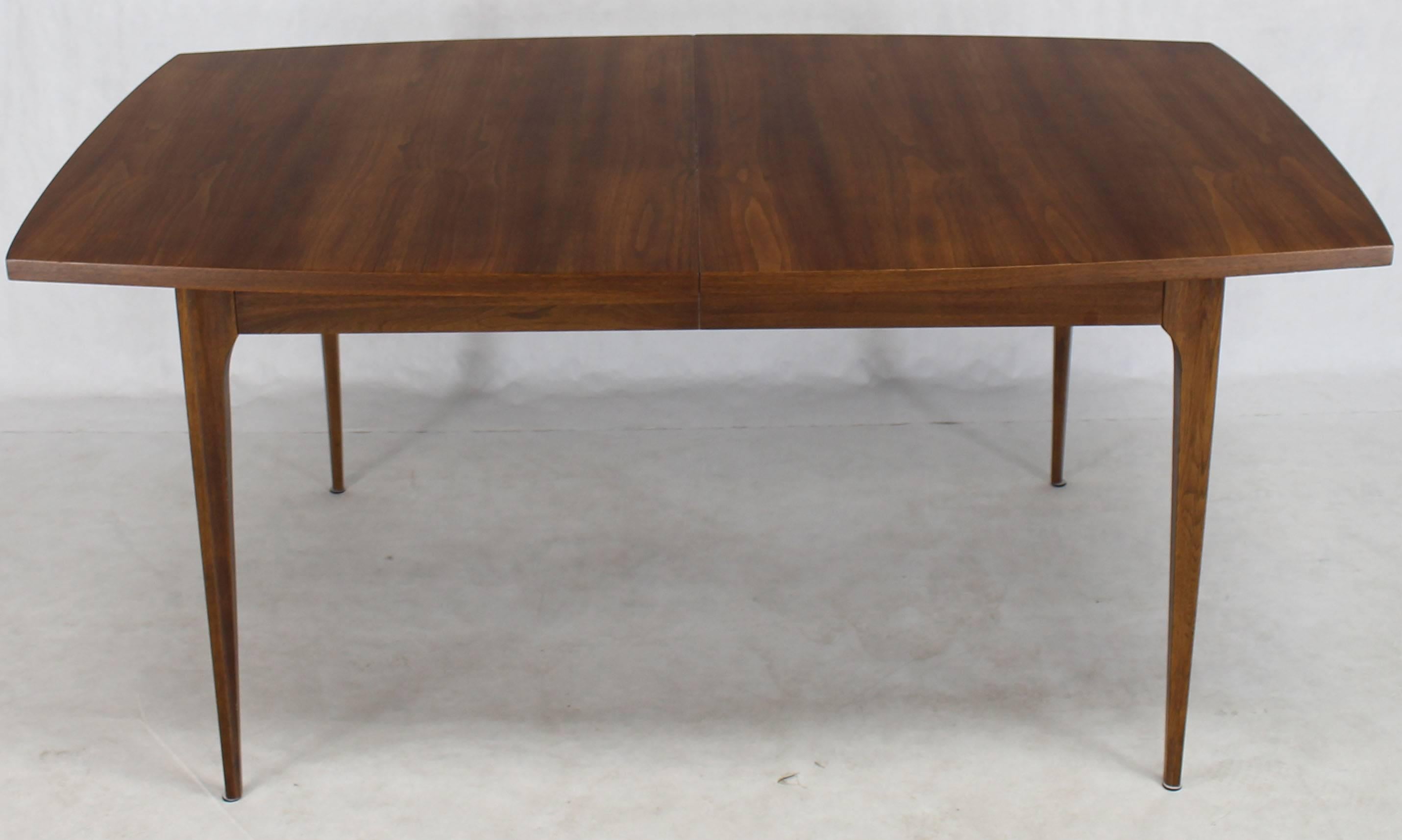 Walnut Mid-Century Modern dining table with one leaf.
