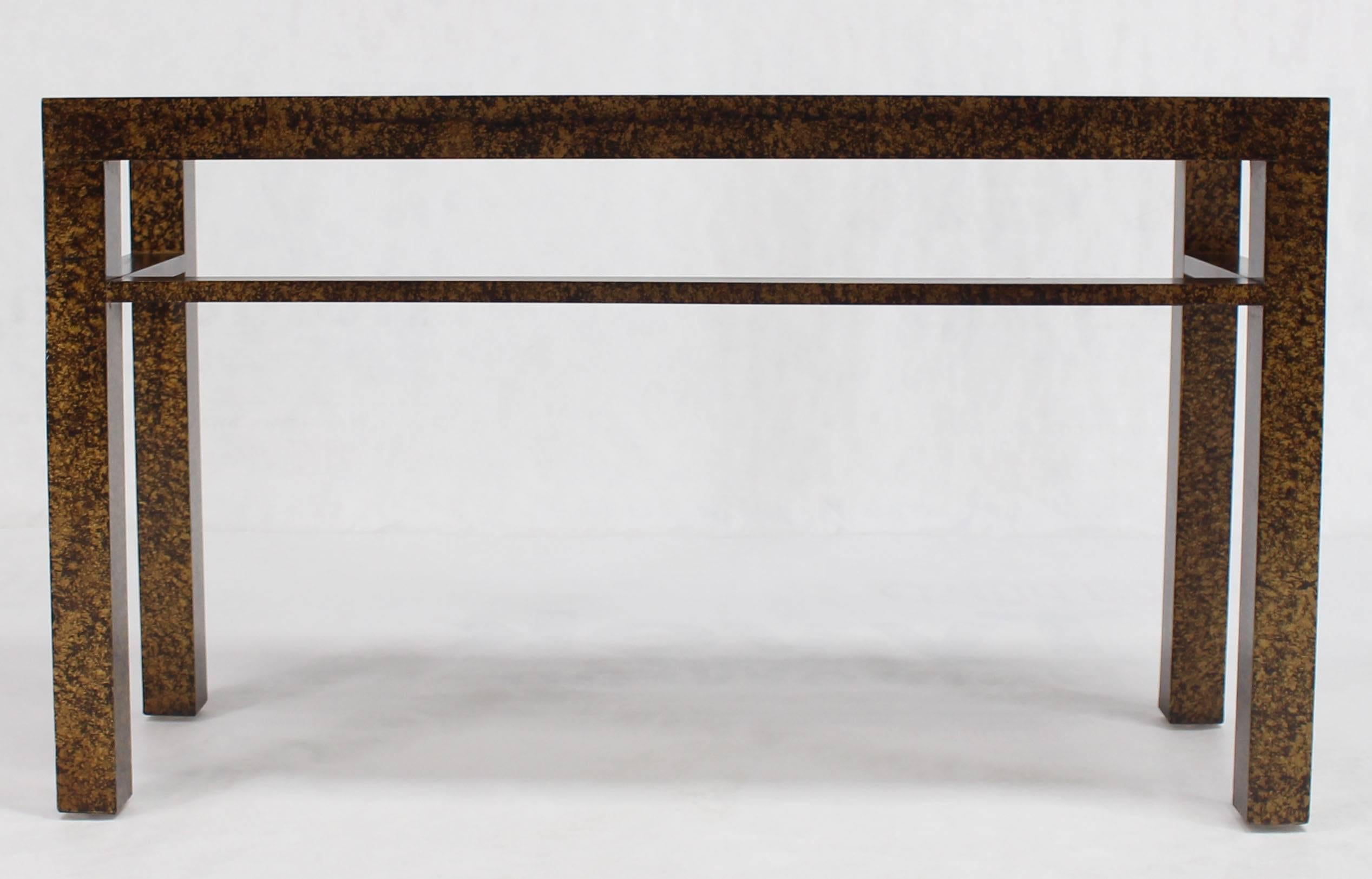Compact design Mid-Century Modern tortoise finish console table. Gold and amber.