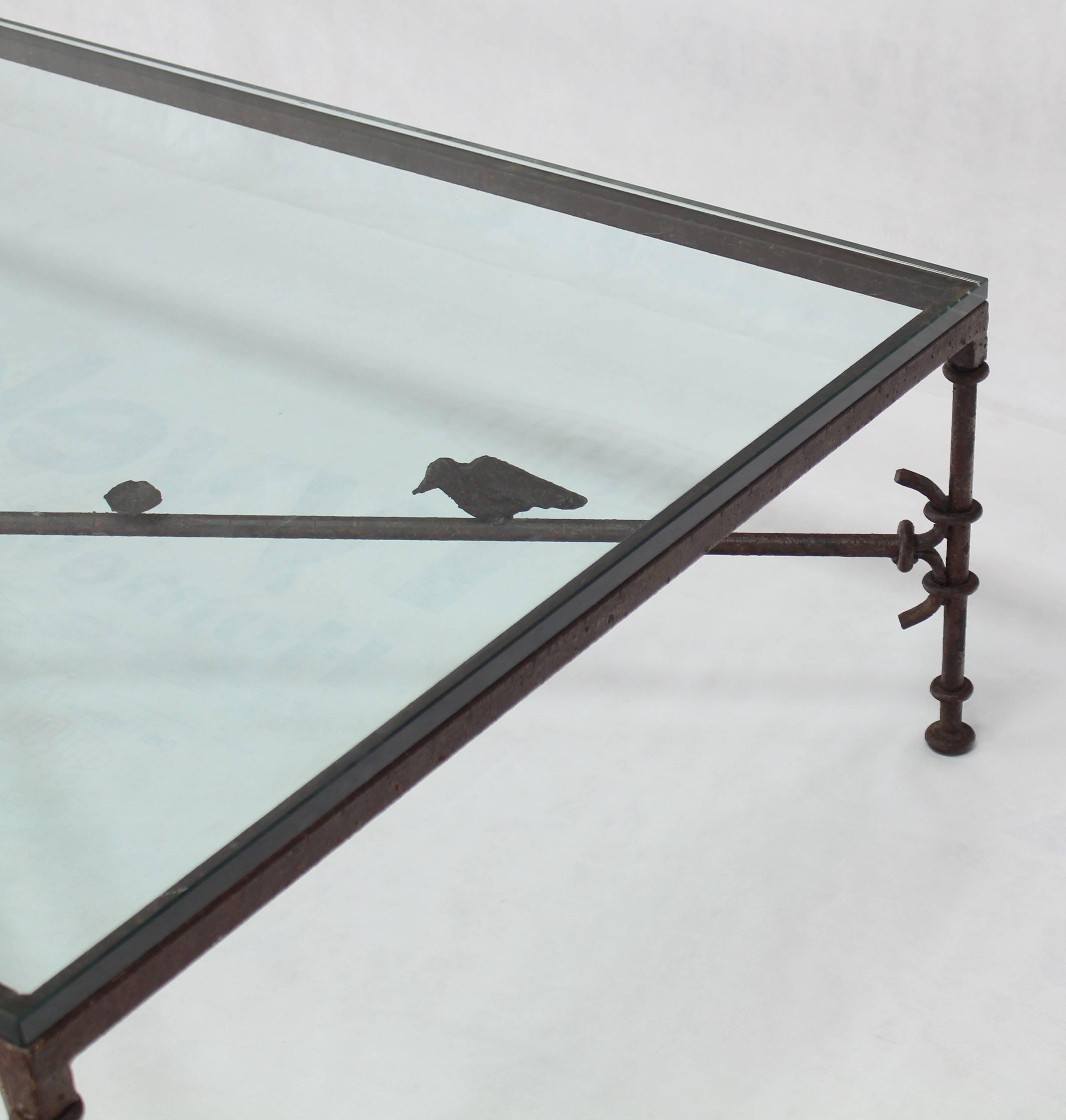 Nice forged metal X-stretcher oversize coffee table with birds.