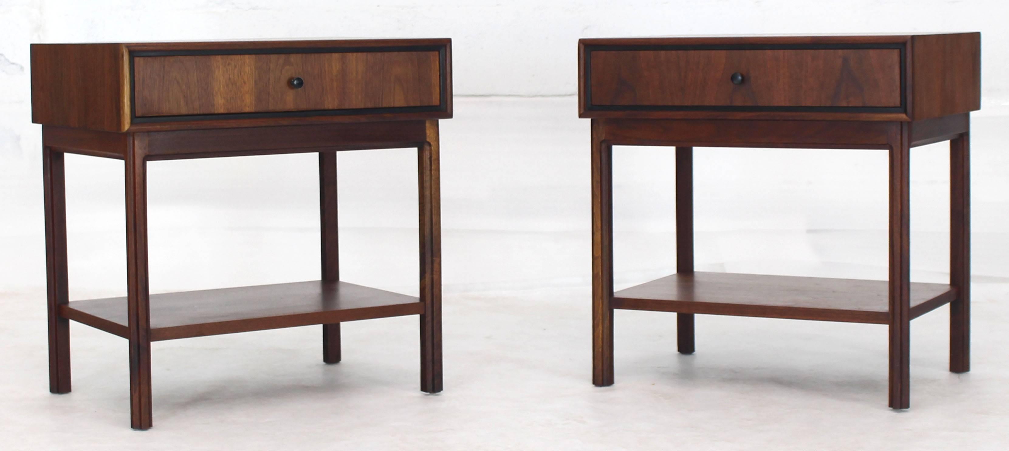Pair of quality Mid-Century Modern oiled walnut nightstands or end tables.