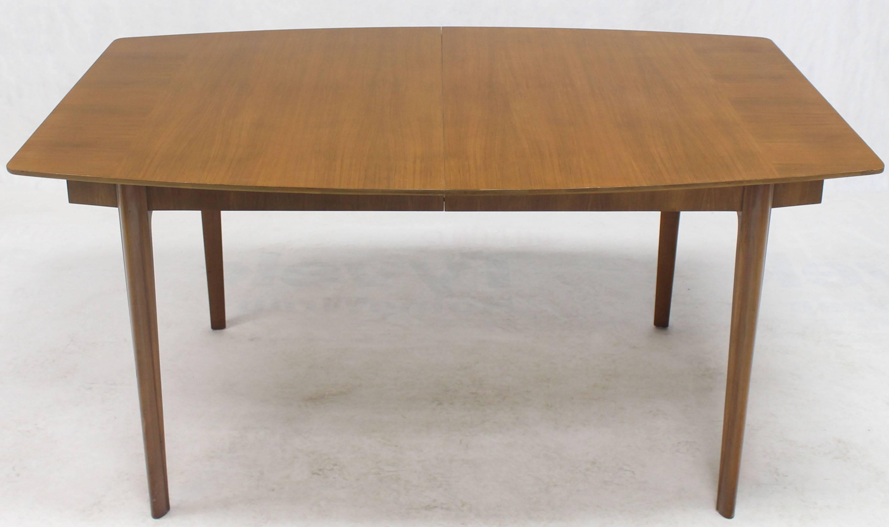 Solid mid century modern medium walnut dining table by Widdicomb. Two 18
