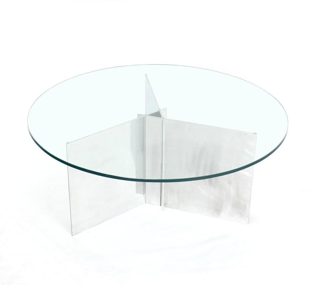 Aluminum interlocking blades base coffee table with glass top.