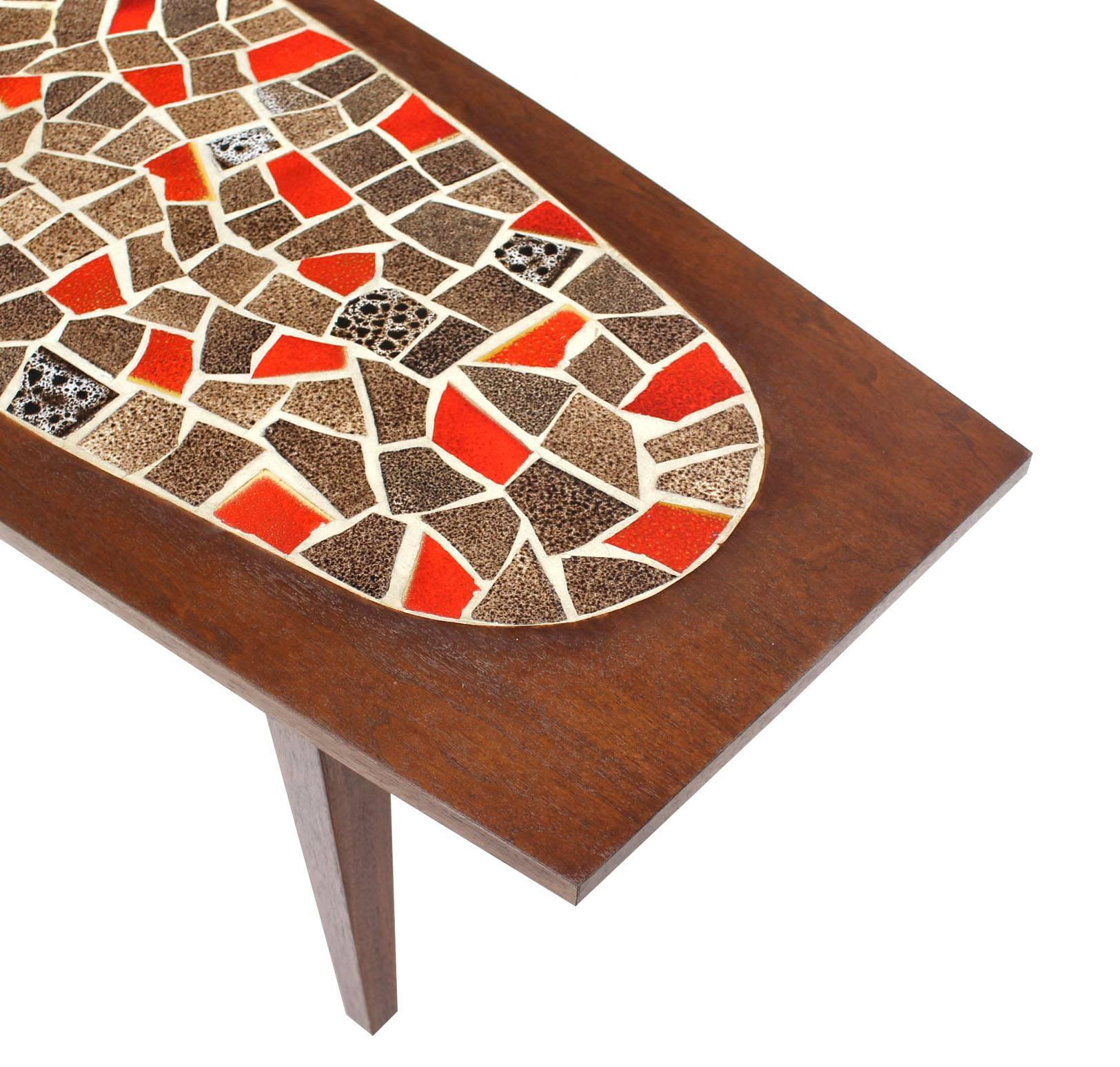 Very nice mossaic tile top boat shape coffee table.