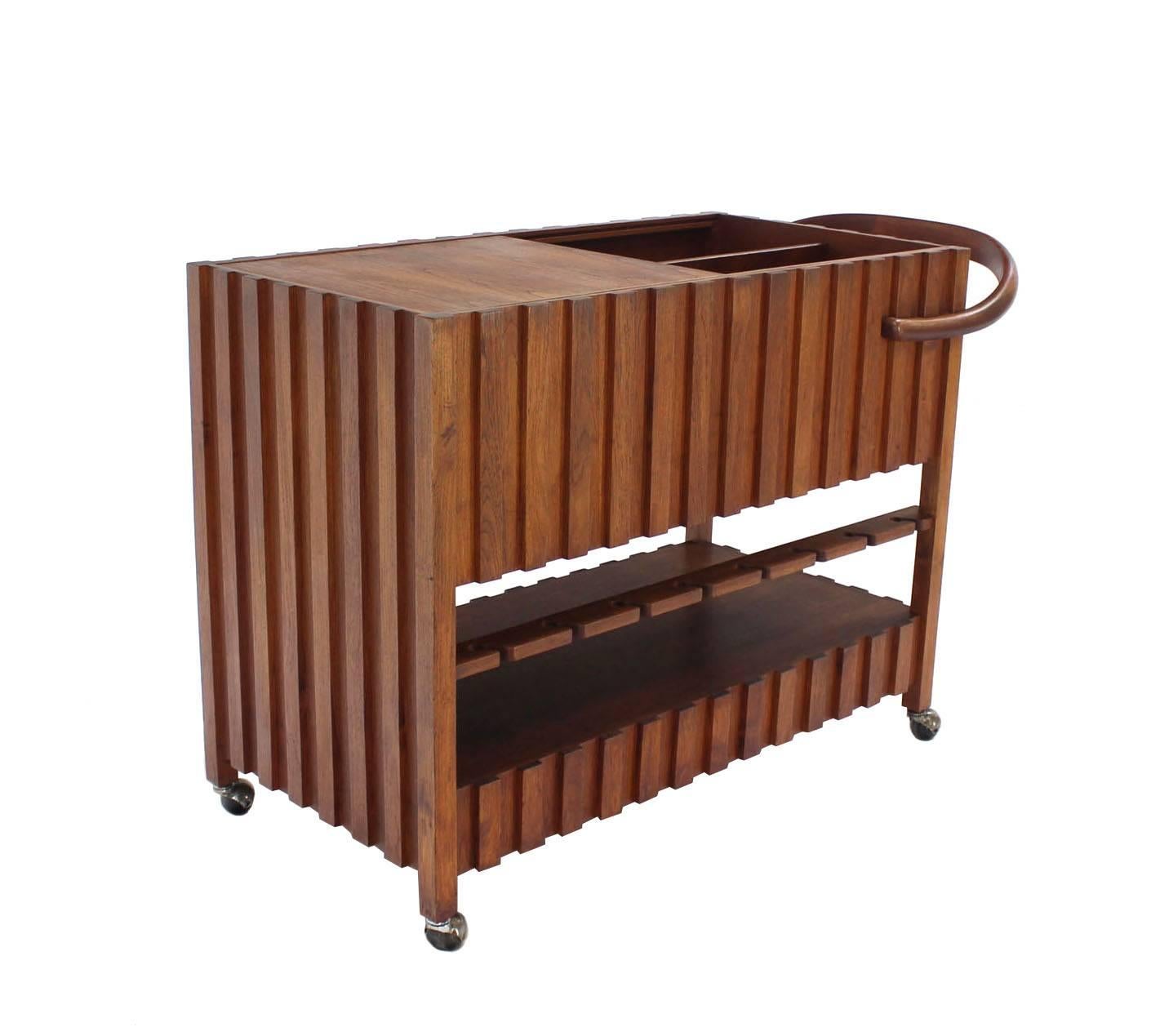 Very nice solid oiled walnut mid century modern bar cart in style of Adrian Pearsall.