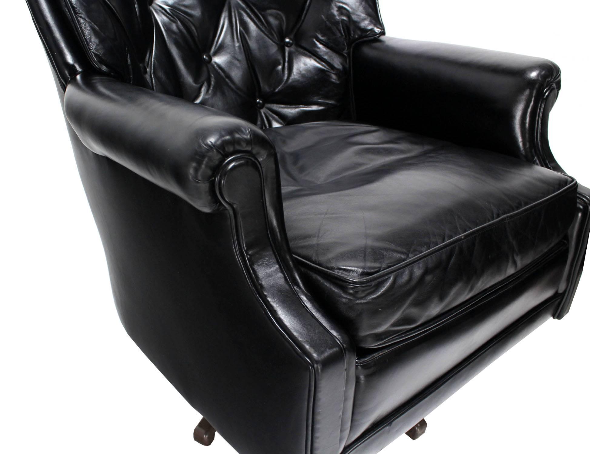 American Pair of Shiny Black Leather Swivel Barrel Back Lounge Chairs 