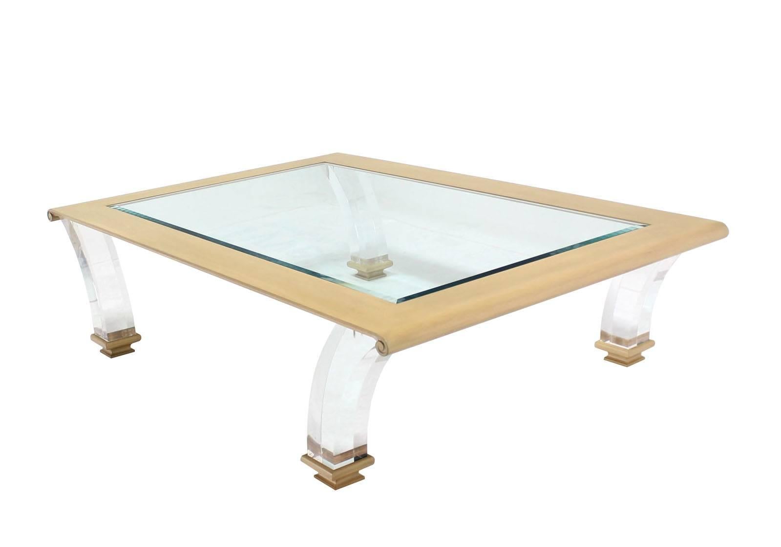 Very elegant looking custom mid century modern style large coffee table on lucite legs. Nice 3/4" thick glass top.