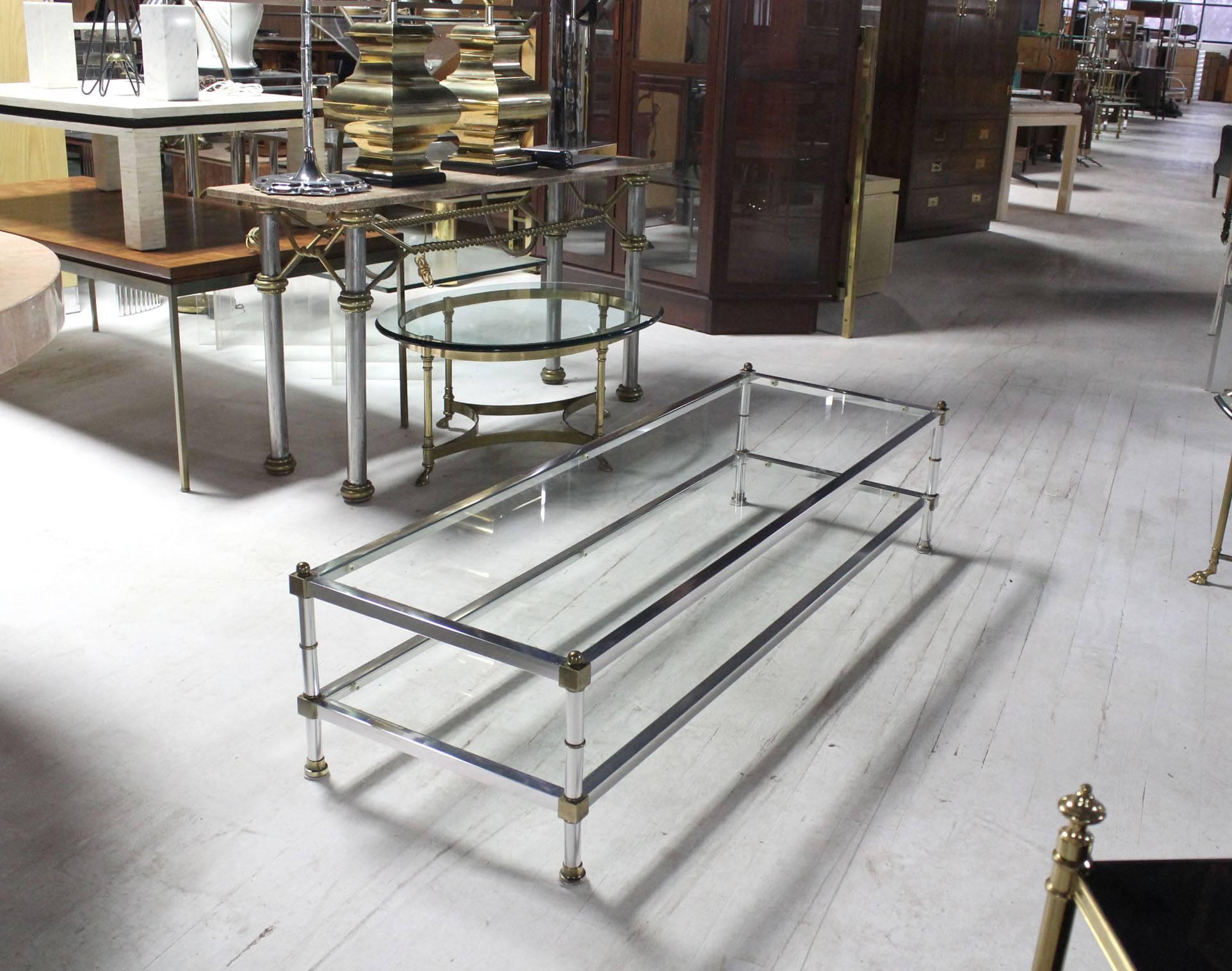 Mid Century Modern brass chrome and glass two tier coffee table.