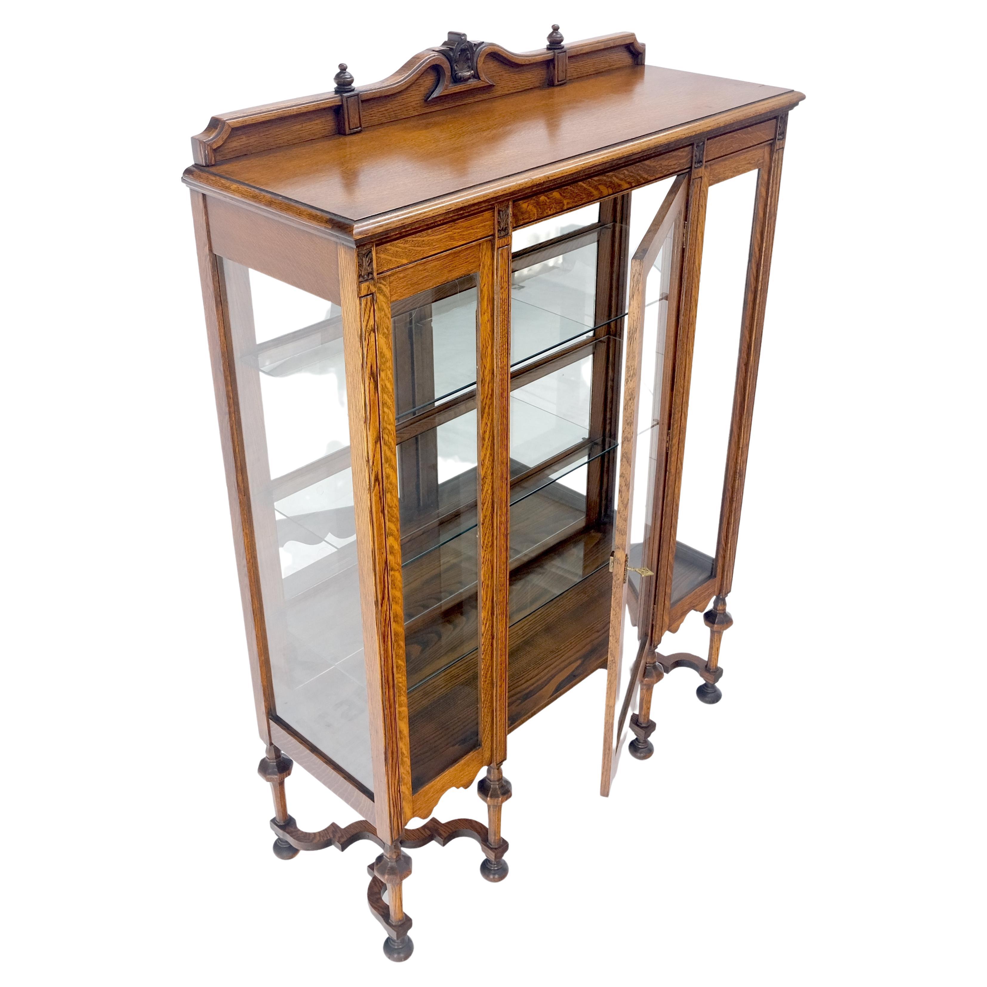 curio cabinet with glass doors and shelves
