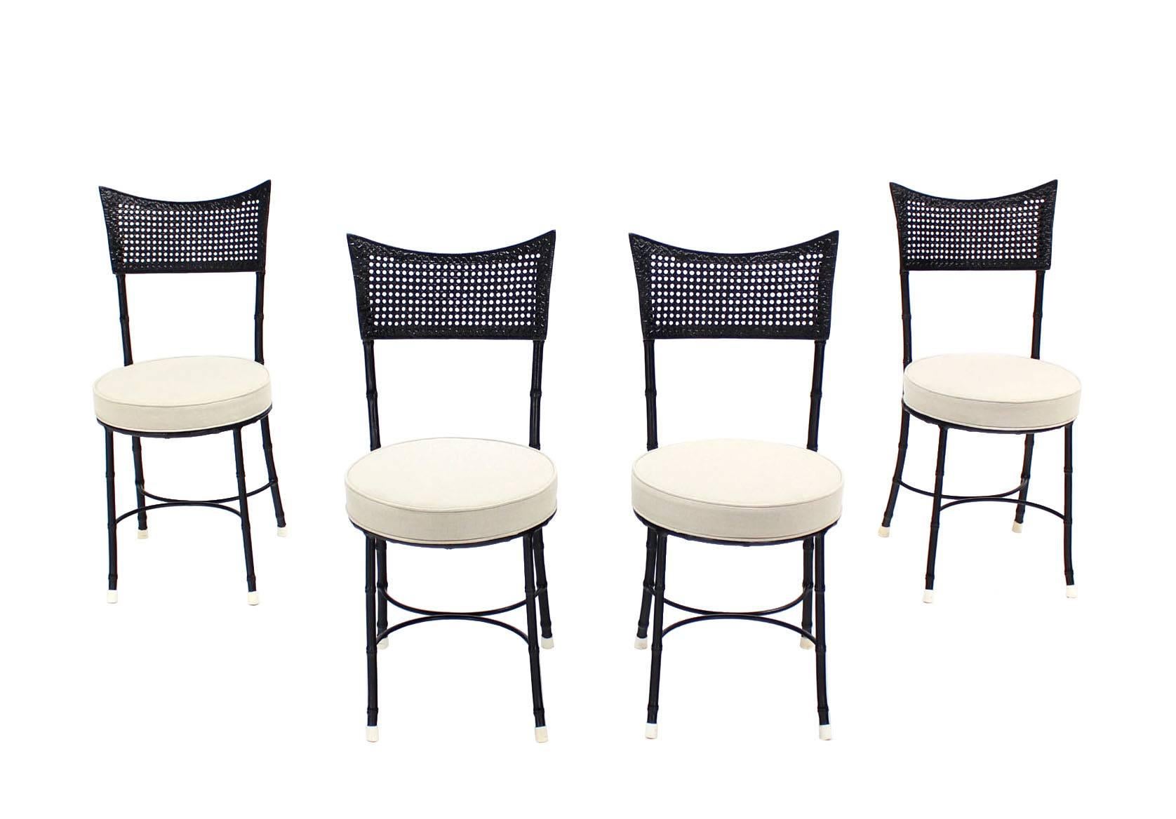 Nice four Mid-Century Modern cast aluminum chairs imitating faux bamboo. With propriate upholstery can be used outdoor. Newly upholstered seats. Nice arch shape stretchers.