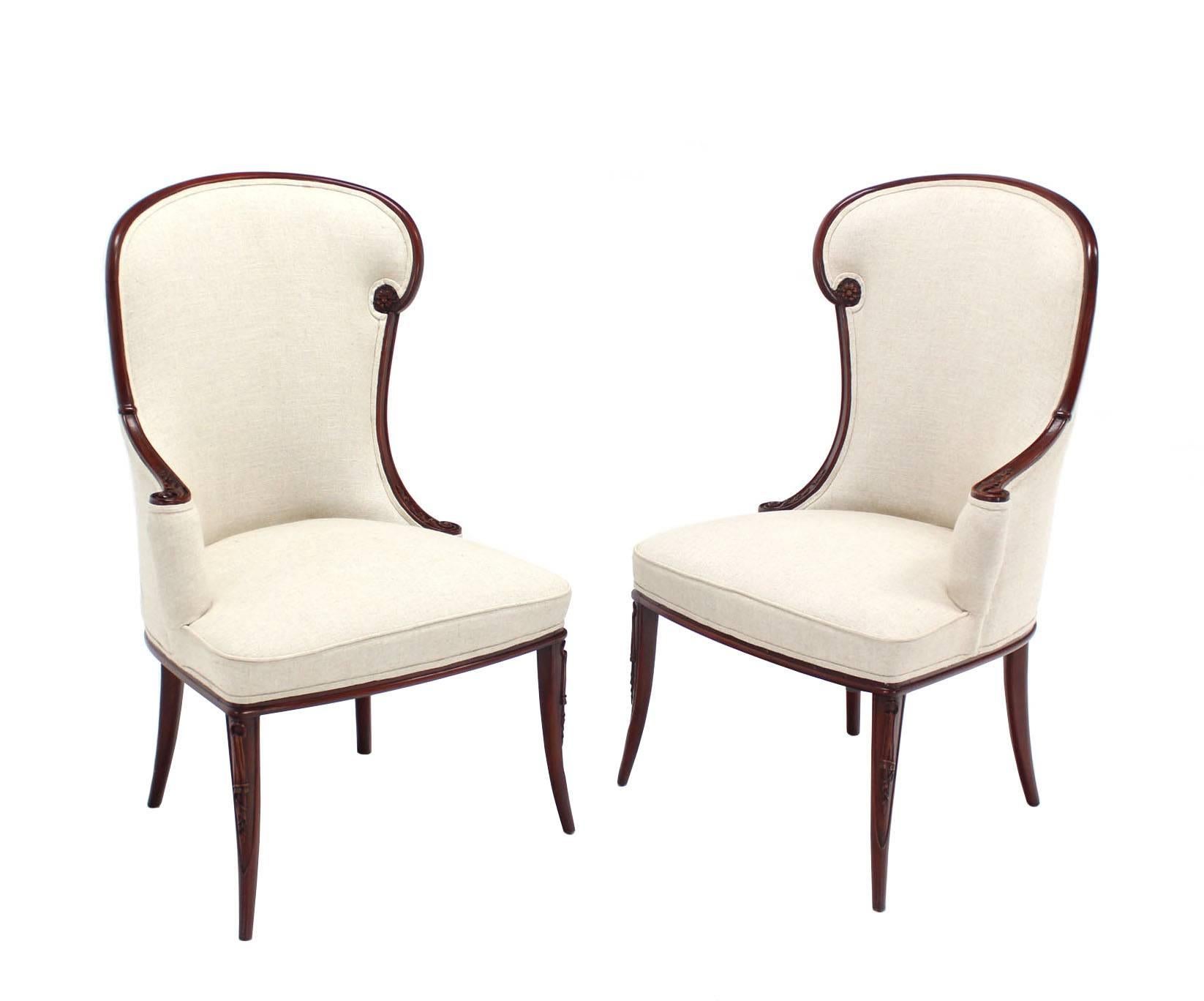 Pair of new Belgian linen upholstery fire side assimetrical wing lounge chairs. Excellent condition, featuring very elegant yet complex design lines.