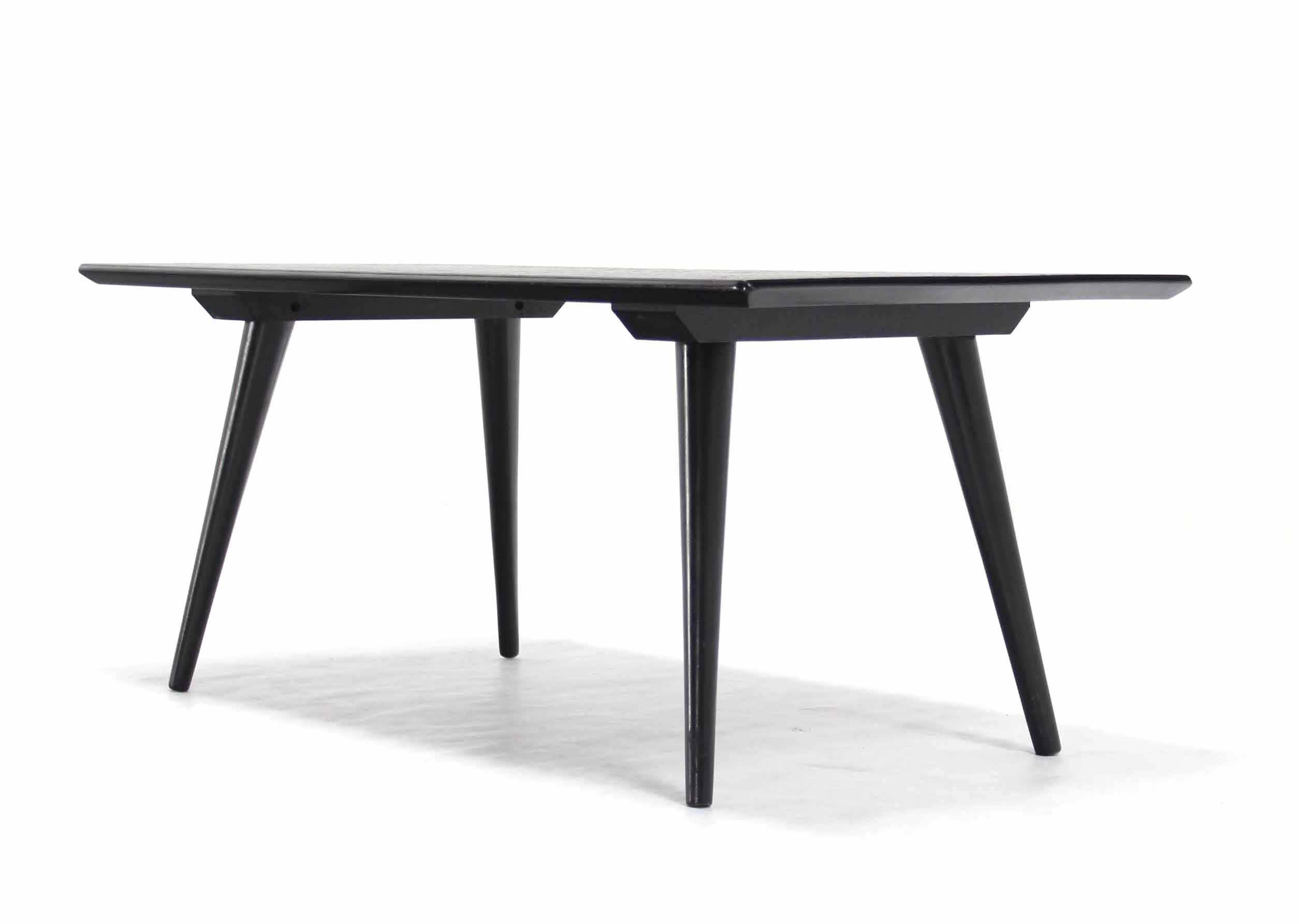 Medium size  Mid-Century Modern ebonized rectangular coffee table. Sharp looking Paul McCobb design classic piece.