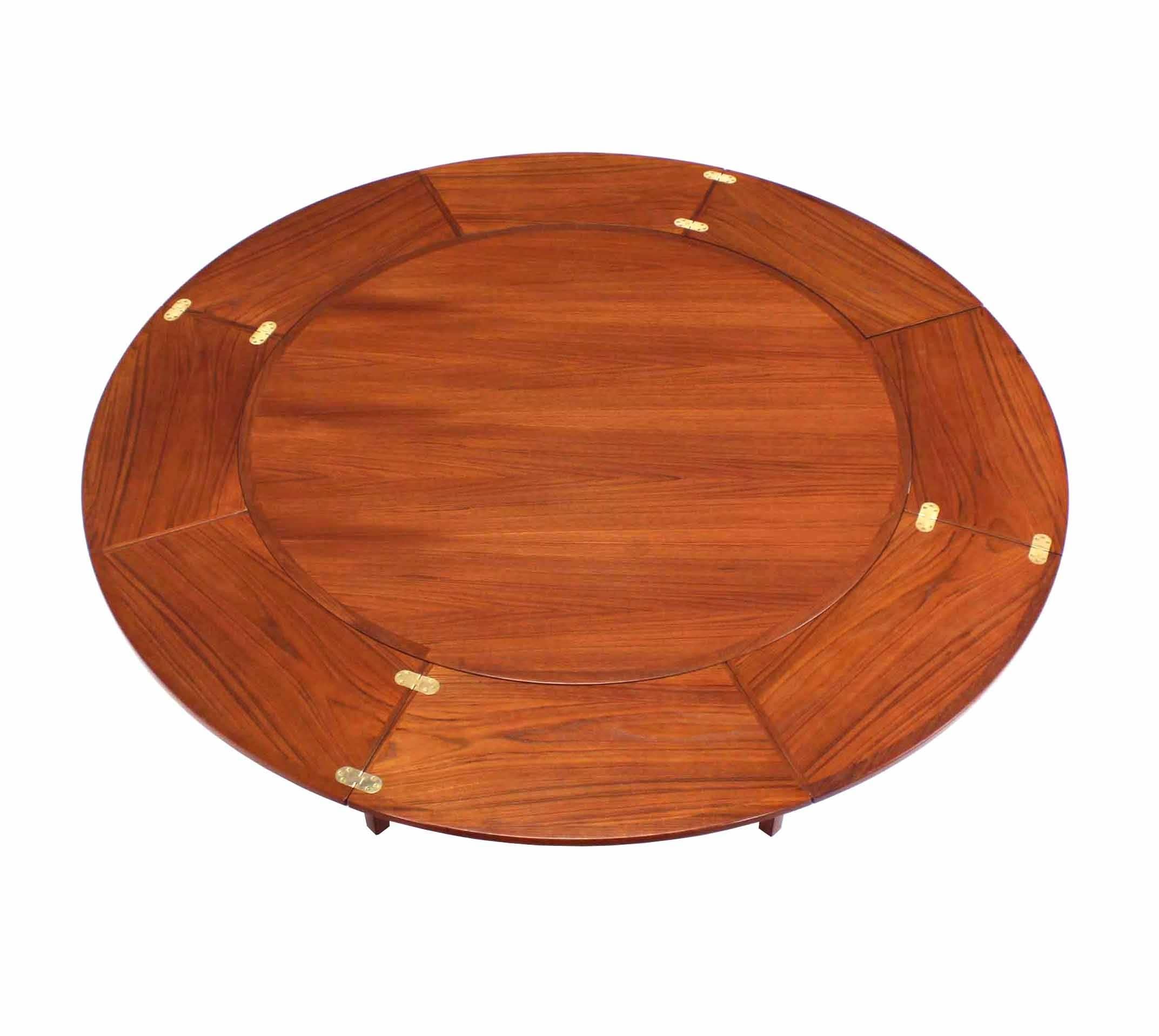 Rare round flip-top leaves dining table expands to 69