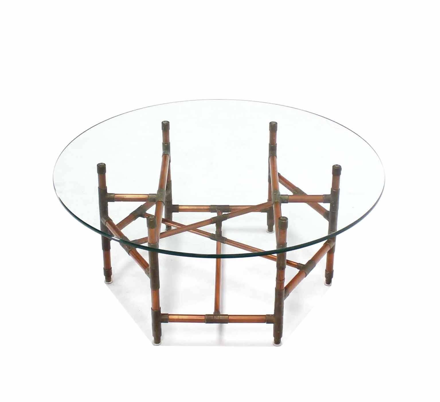 Very creative copper pipe base artwork coffee table with round glass top. Architectural.