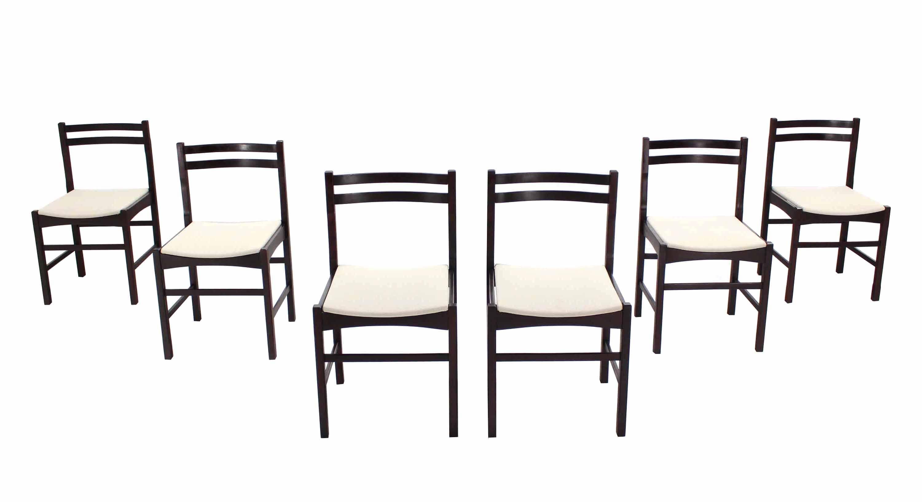 Set of six Danish or Italian modern rosewood dining chairs.
